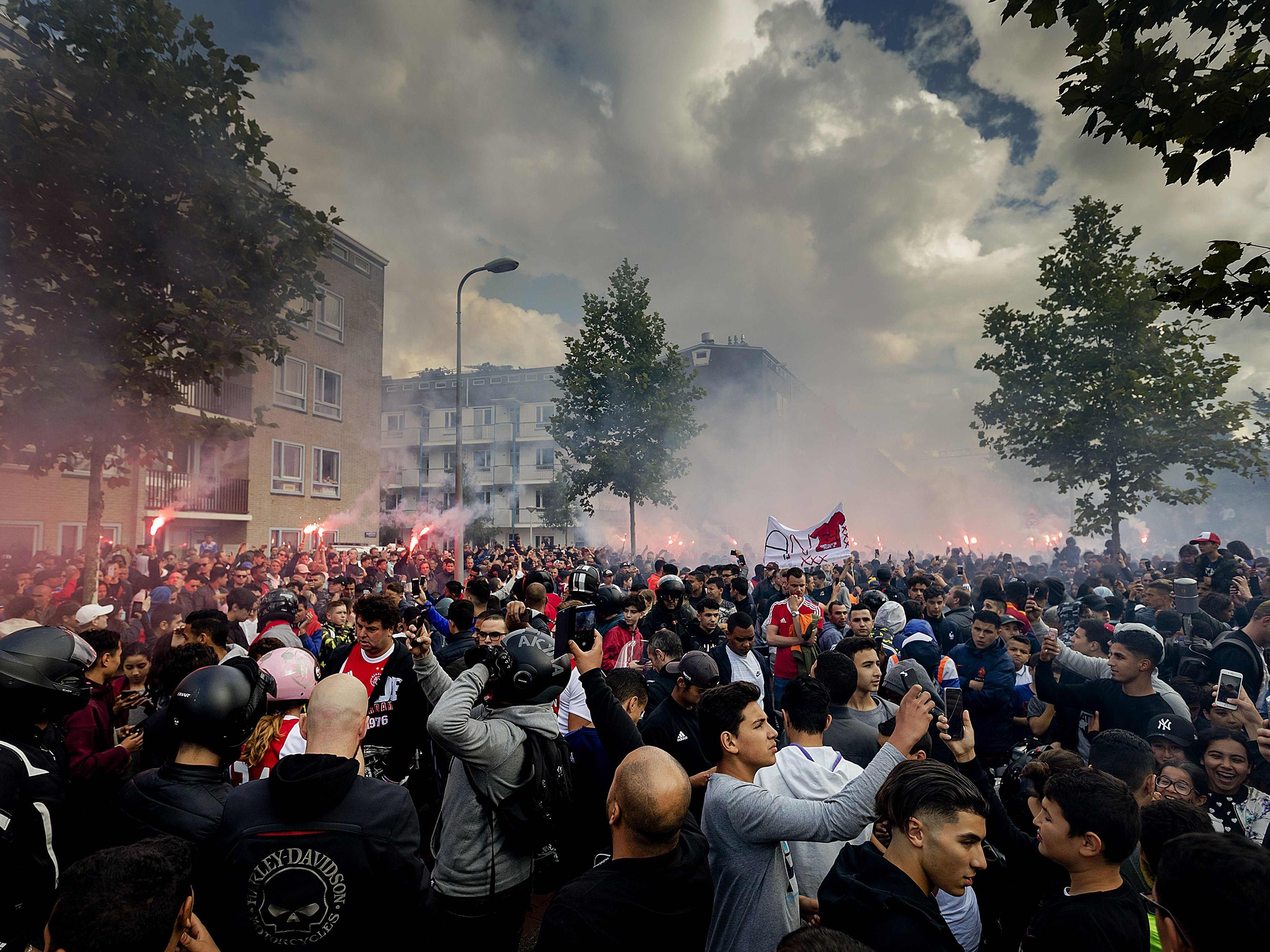 Fans gather outside of the home of Dutch midfielder Abdelhak Nouri on July 14, 2017 in Amsterdam. Ajax Amsterdam's football player Abdelhak Nouri was diagnosed with 'serious and permanent brain damage' after collapsing on July 8 during a practice match against Werder Bremen. / AFP PHOTO / ANP / Robin van Lonkhuijsen / Netherlands OUTROBIN VAN LONKHUIJSEN/AFP/Getty Images