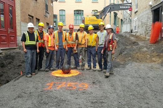 Workers who found the cannonball gathered round to take snaps with it.