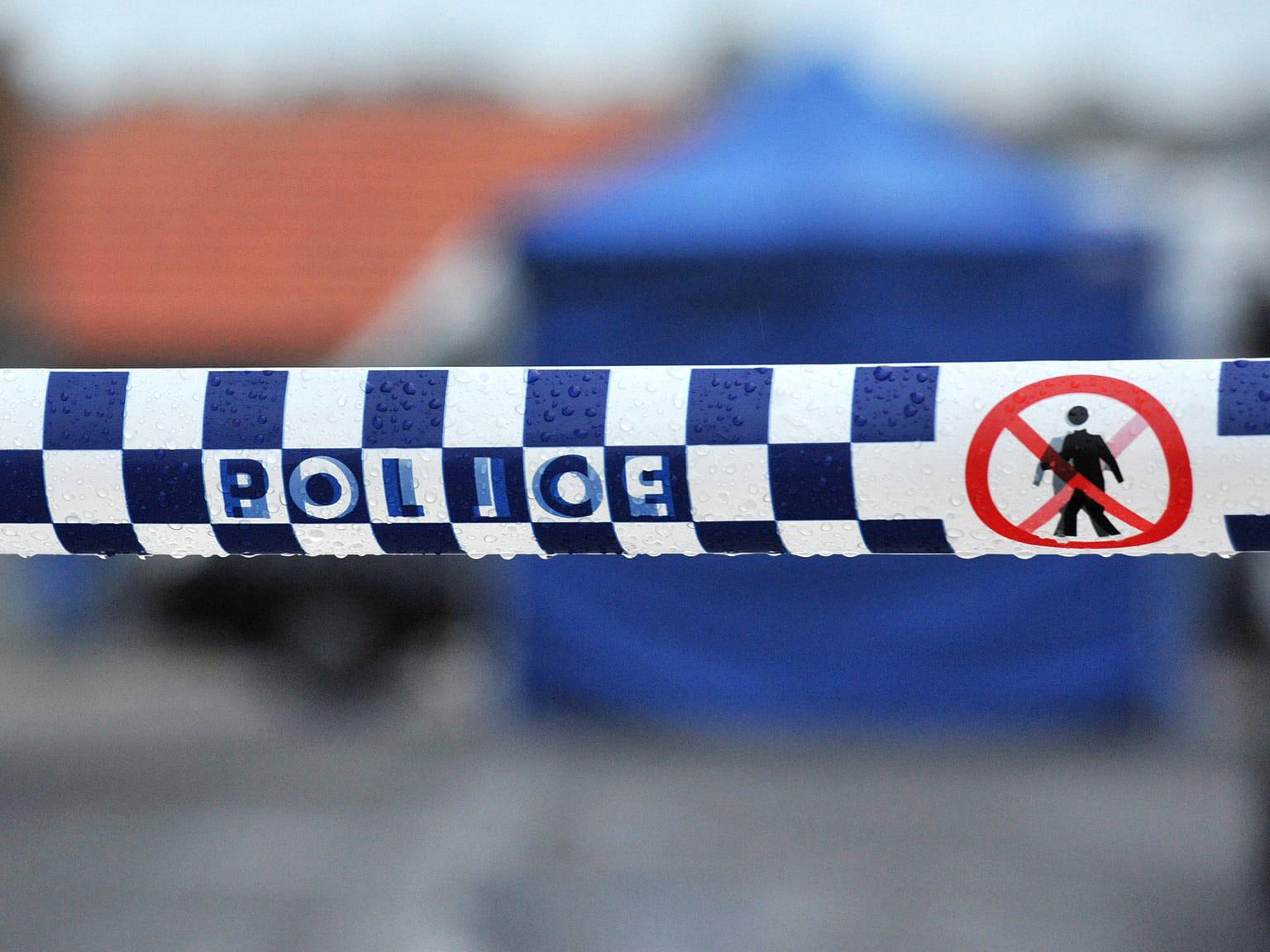 The woman found in Bulimba unit was taken to hospital in a critical condition, where she remains