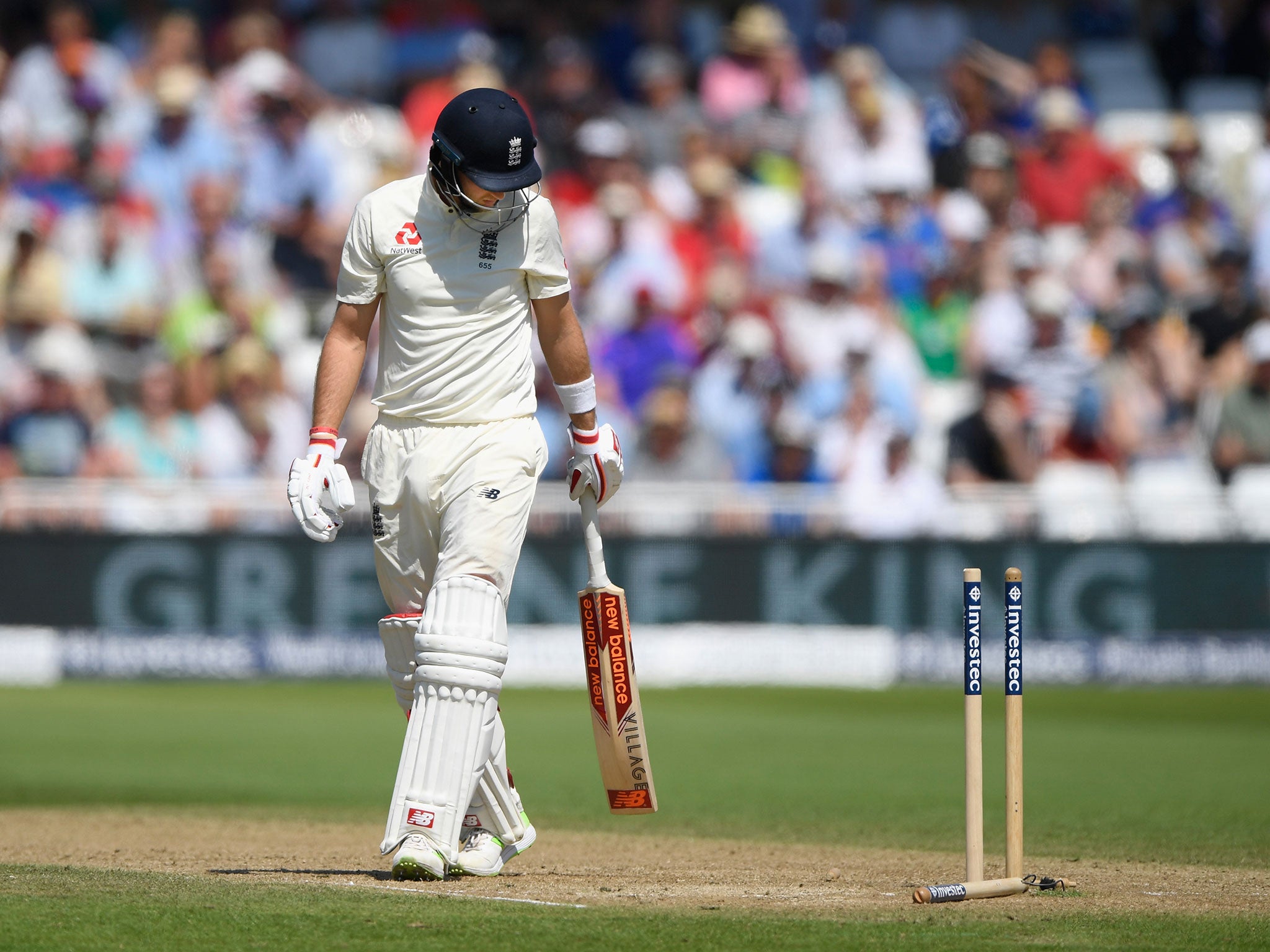 Joe Root looks back at his stumps after being bowled by Chris Morris