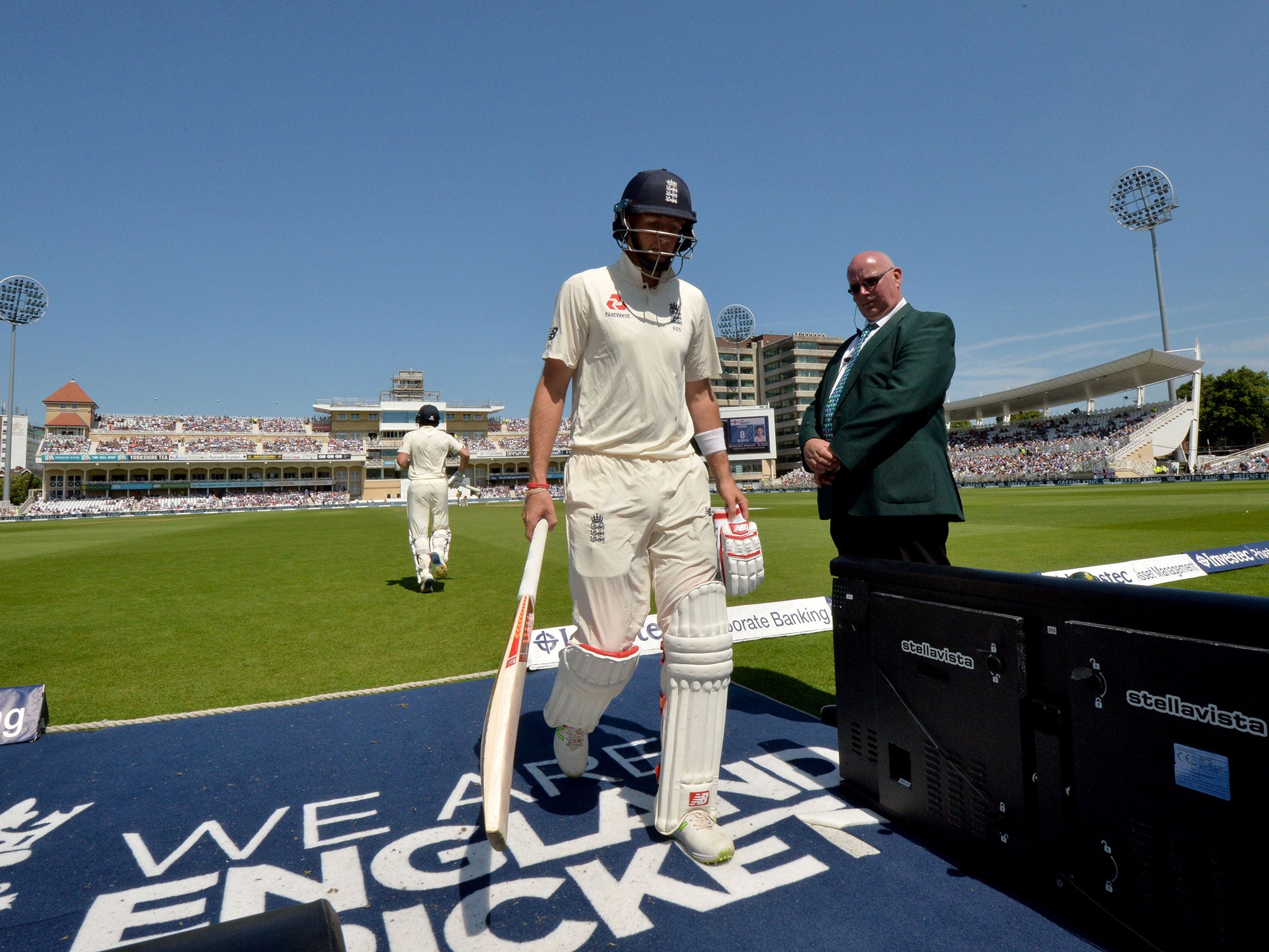 The England captain makes his way off the pitch after being dismissed