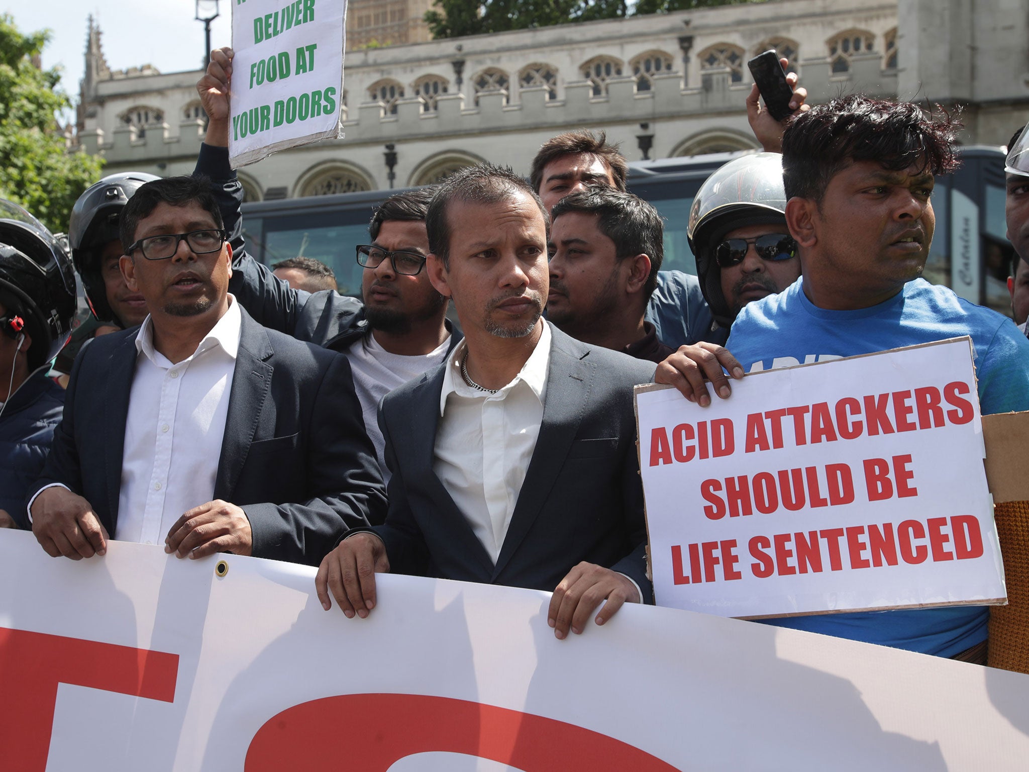 Acid attack victim Jabed Hussain (centre) during a demonstration in Parliament Square on 18 July