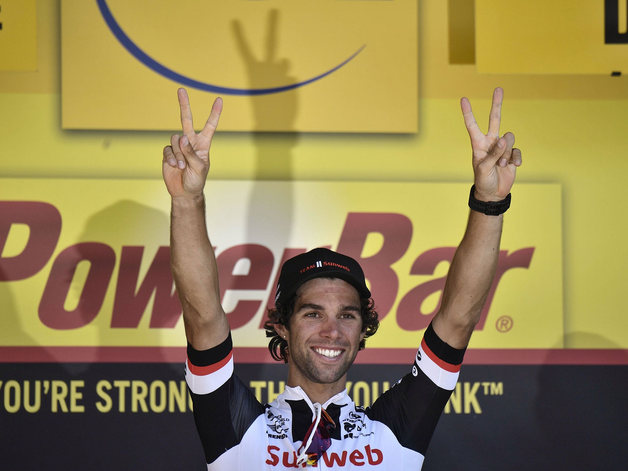 Michael Matthews celebrates on the podium after his victory