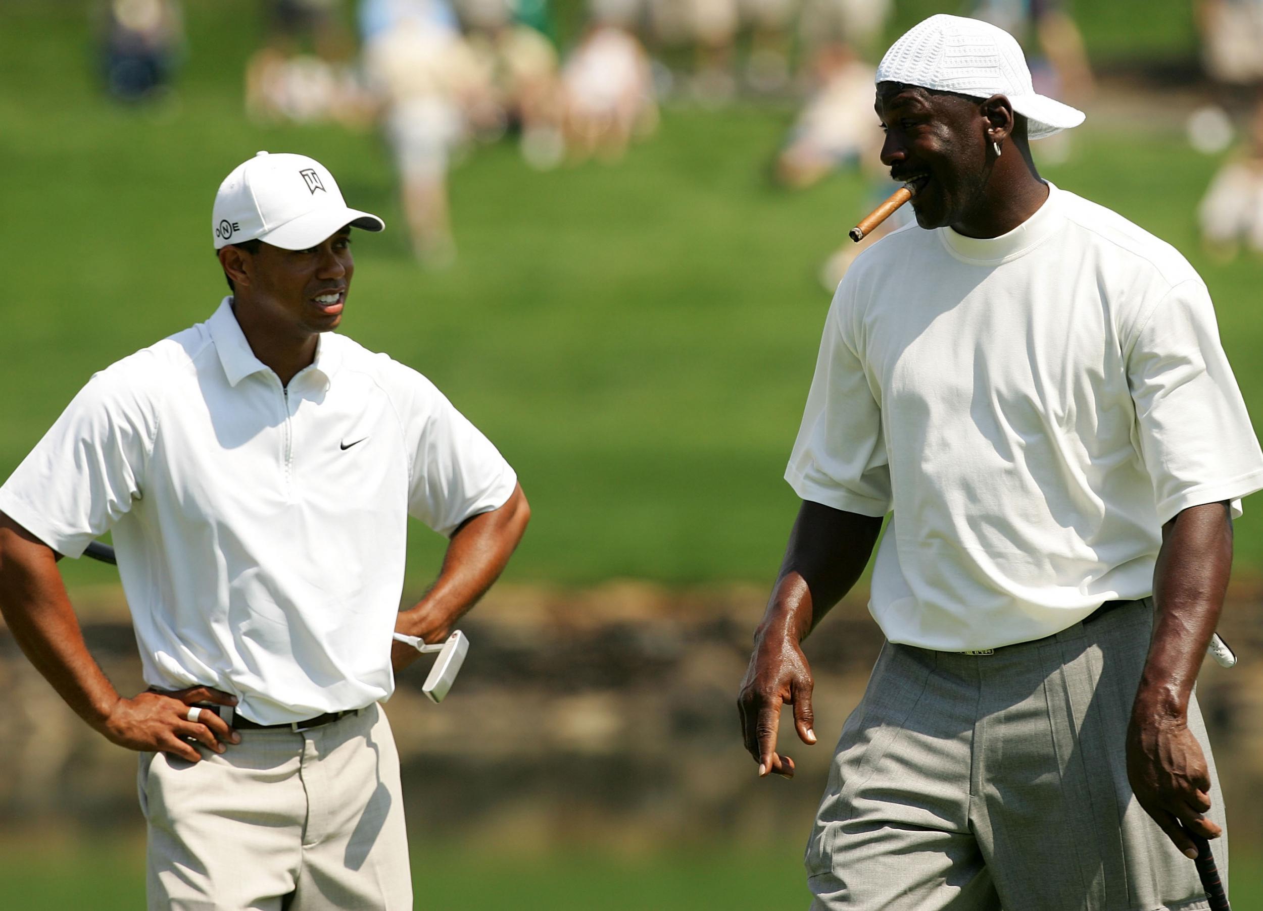 Tiger Woods (L) and Michael Jordan