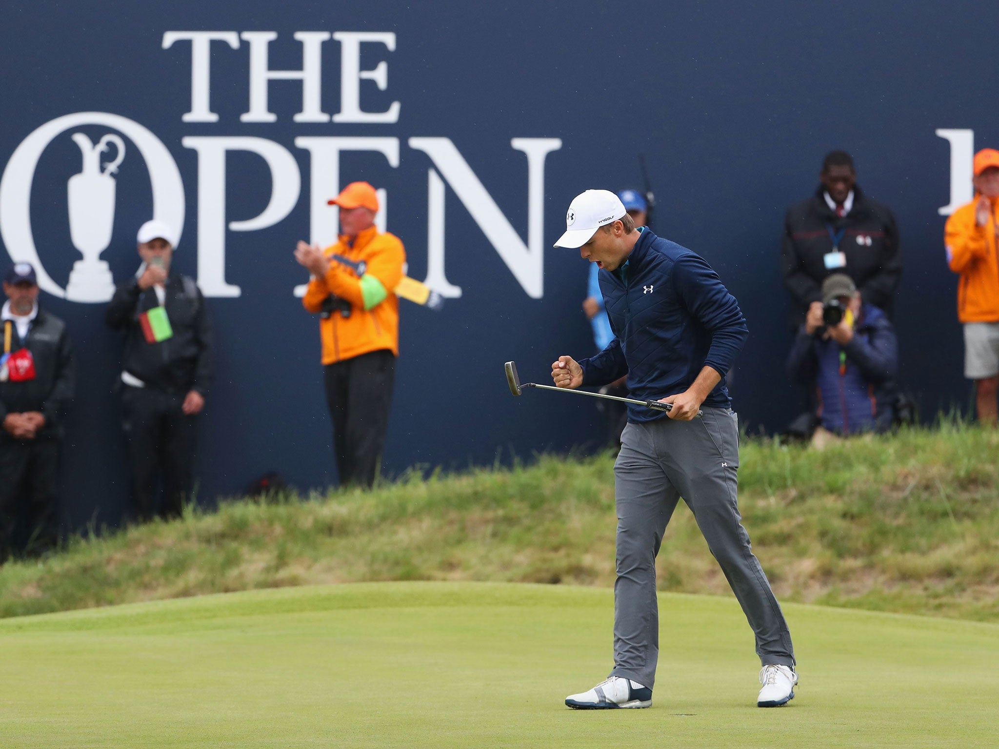 Jordan Spieth celebrates after sinking the winning putt