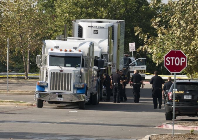 epa06105454 Officials tow a truck that was found to contain 38 suspected illegal immigrants in San Antonio, Texas, USA, 23 July 2017. Eight of the people died at the scene, seventeen were transported to area hospitals with life-threatening injuries, and thirteen people had non-life-threatening injuries, police said. EPA/DARREN ABATE