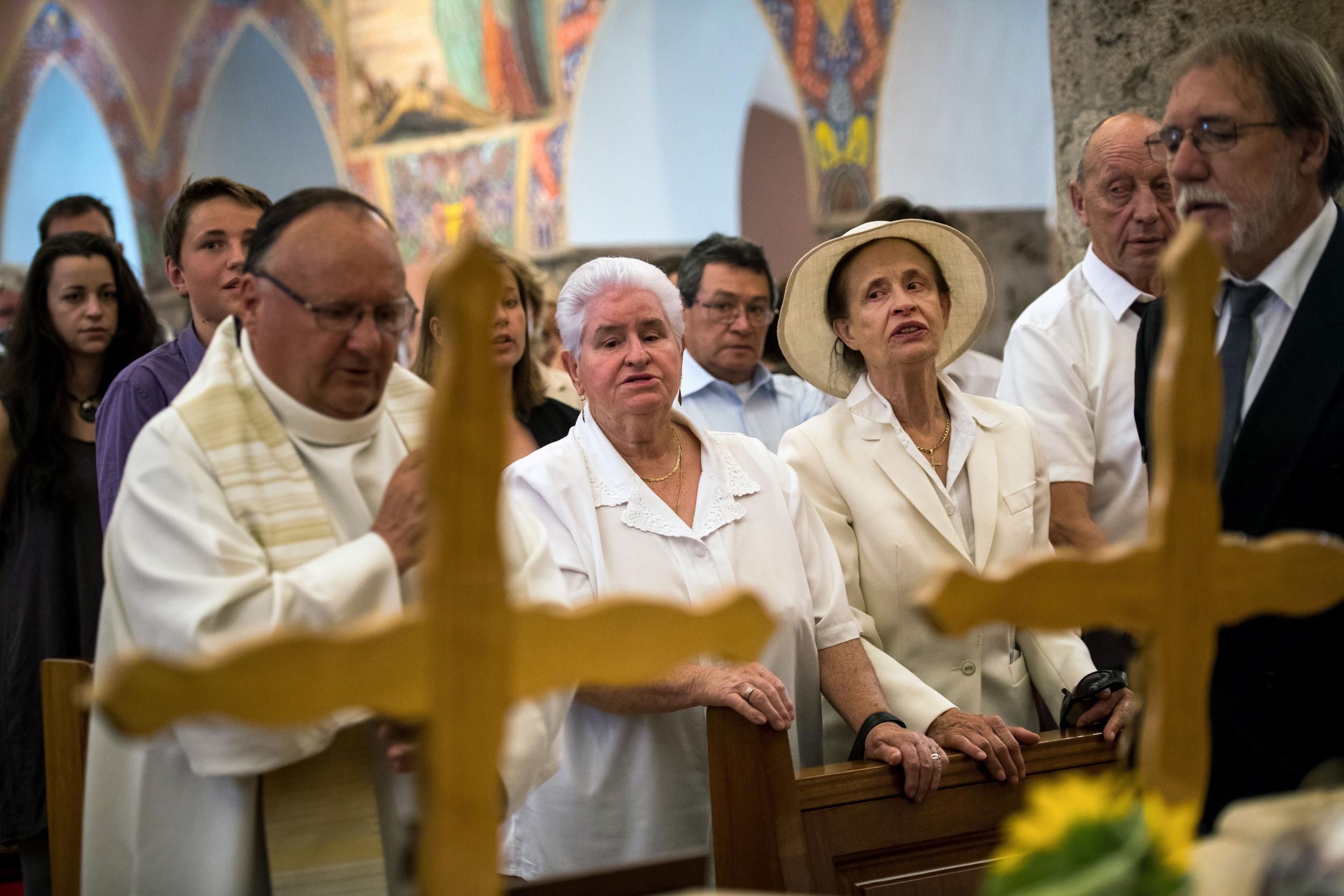 Mourners say farewell to couple who went missing after they set out to tend their cattle in a nearby mountain pasture