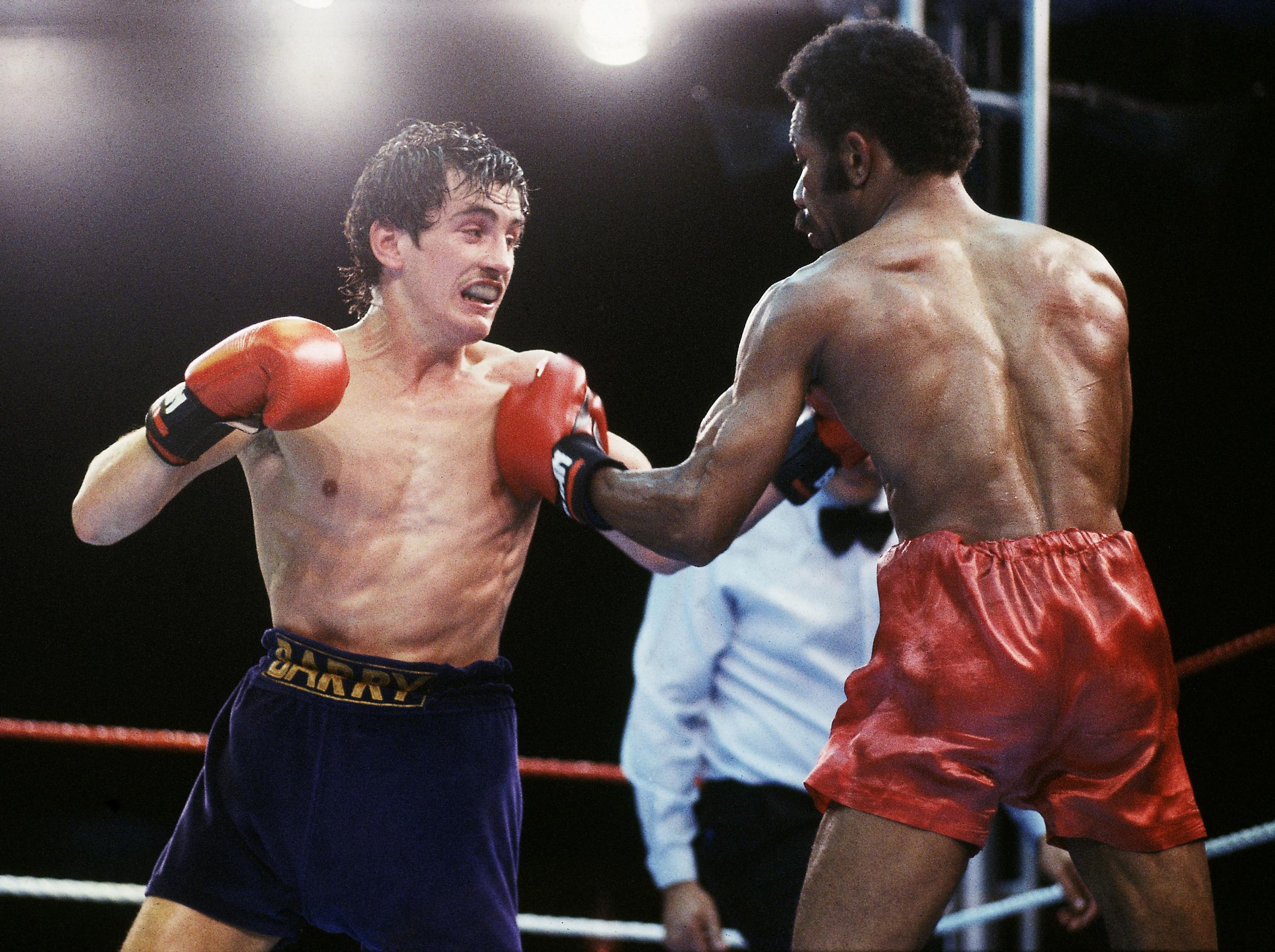 McGuigan in action against WBA Champion Eusebio Pedroza of Panama, in 1985