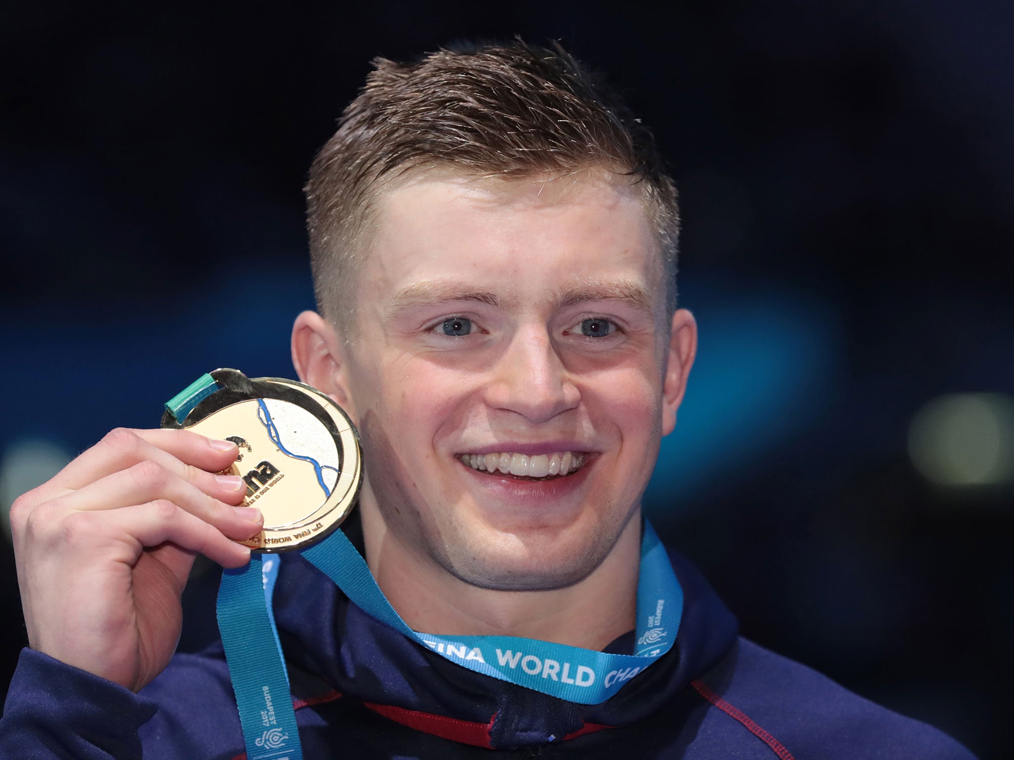 Peaty with his gold medal on the podium