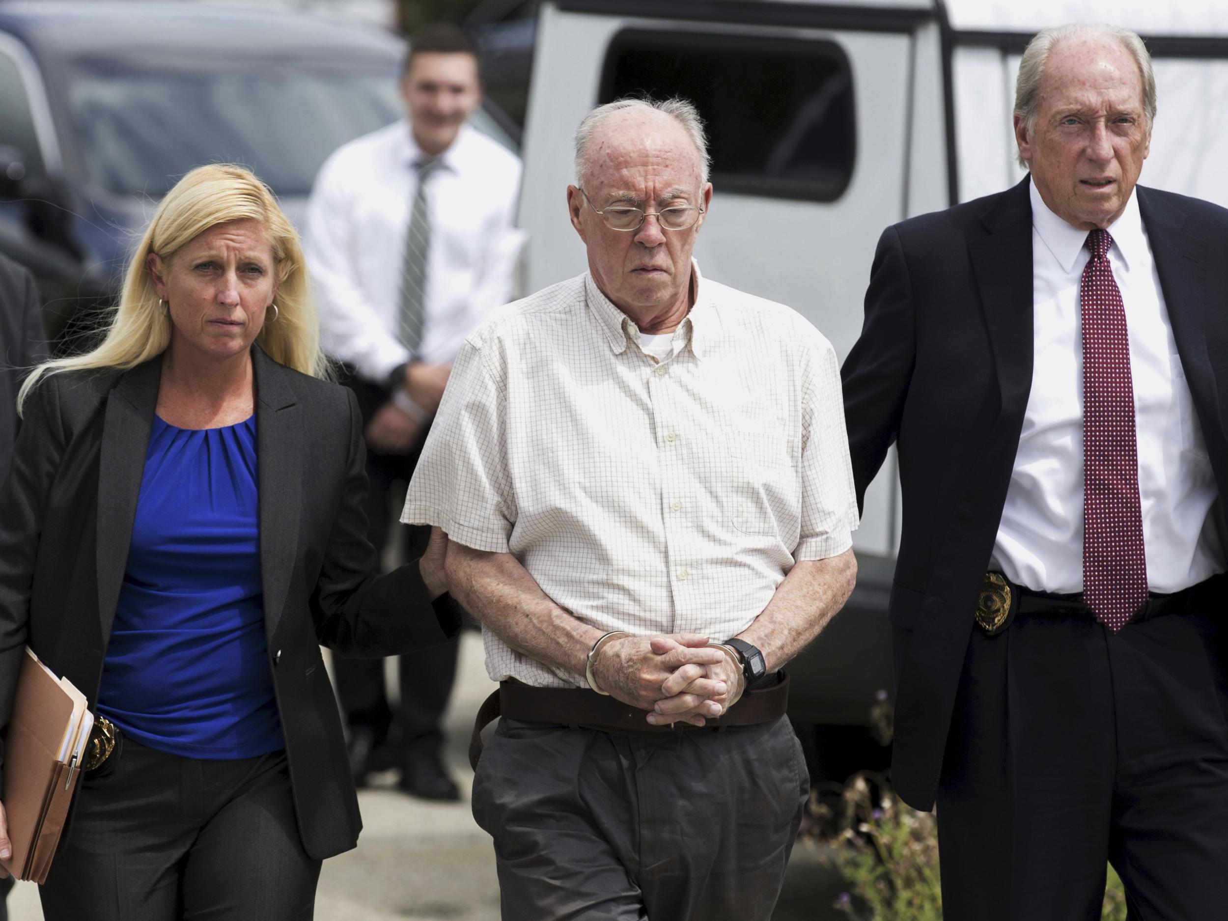 The Reverend John Thomas Sweeney, centre, enters court in Leechburg, Pennsylvania