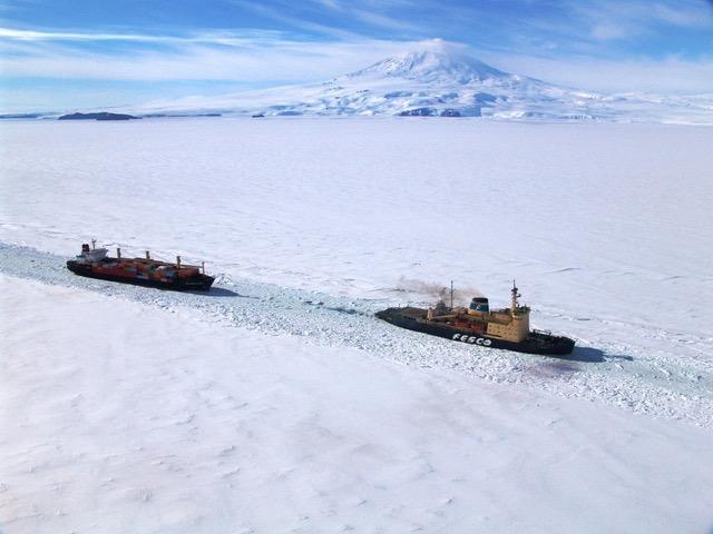 The MV American Tern being led by the Russian icebreaker Krasin to McMurdo Station during Operation Deep Freeze 2006. Mount Erebus can be seen in the background