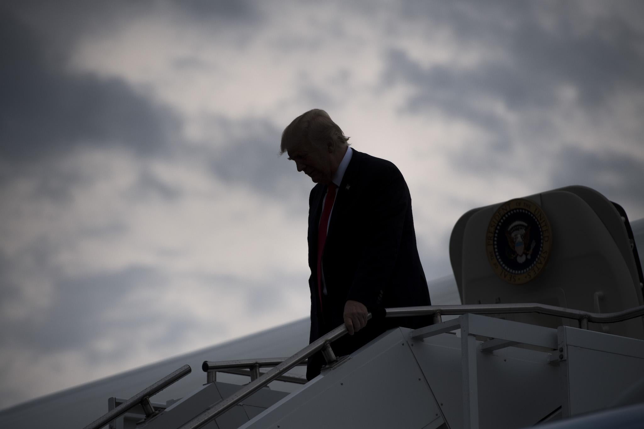 US President Donald Trump disembarks from Air Force One upon arrival at Raleigh County Memorial Airport in Beaver, West Virginia, July 24, 2017