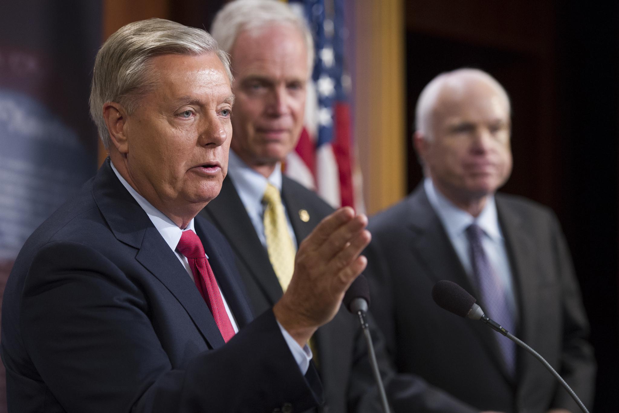 From left, Senator Lindsey Graham, Senator Ron Johnson and Senator John McCain