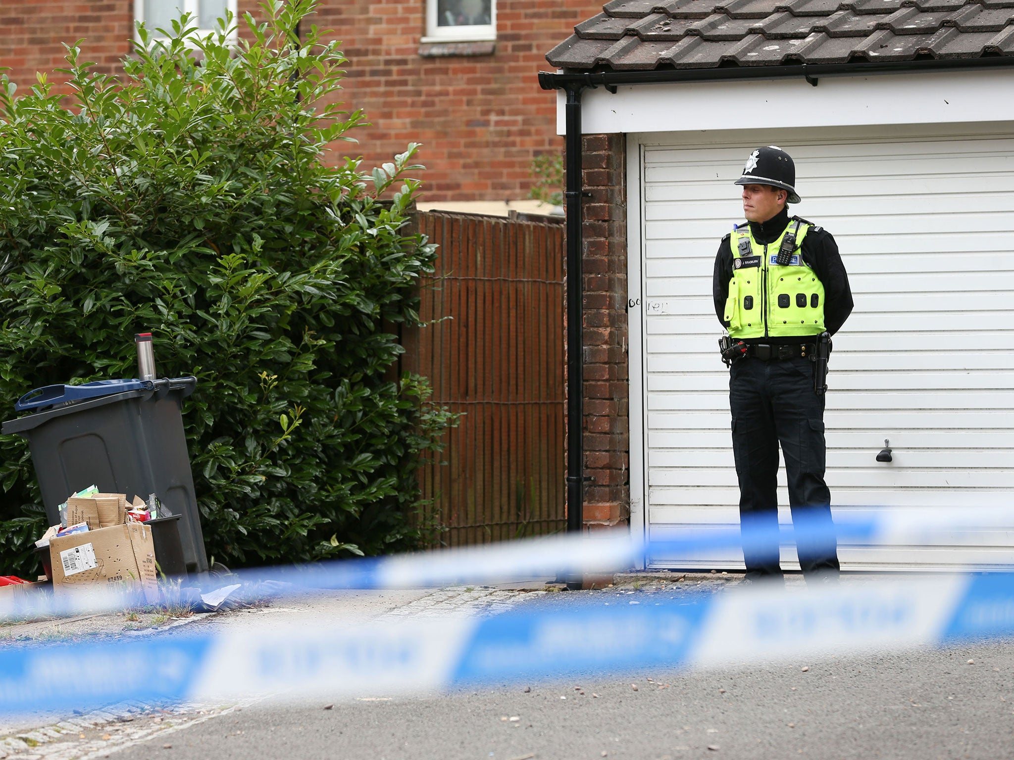 Police at the scene where armed officers shot a man in Hereford Close, Frankley, Birmingham.