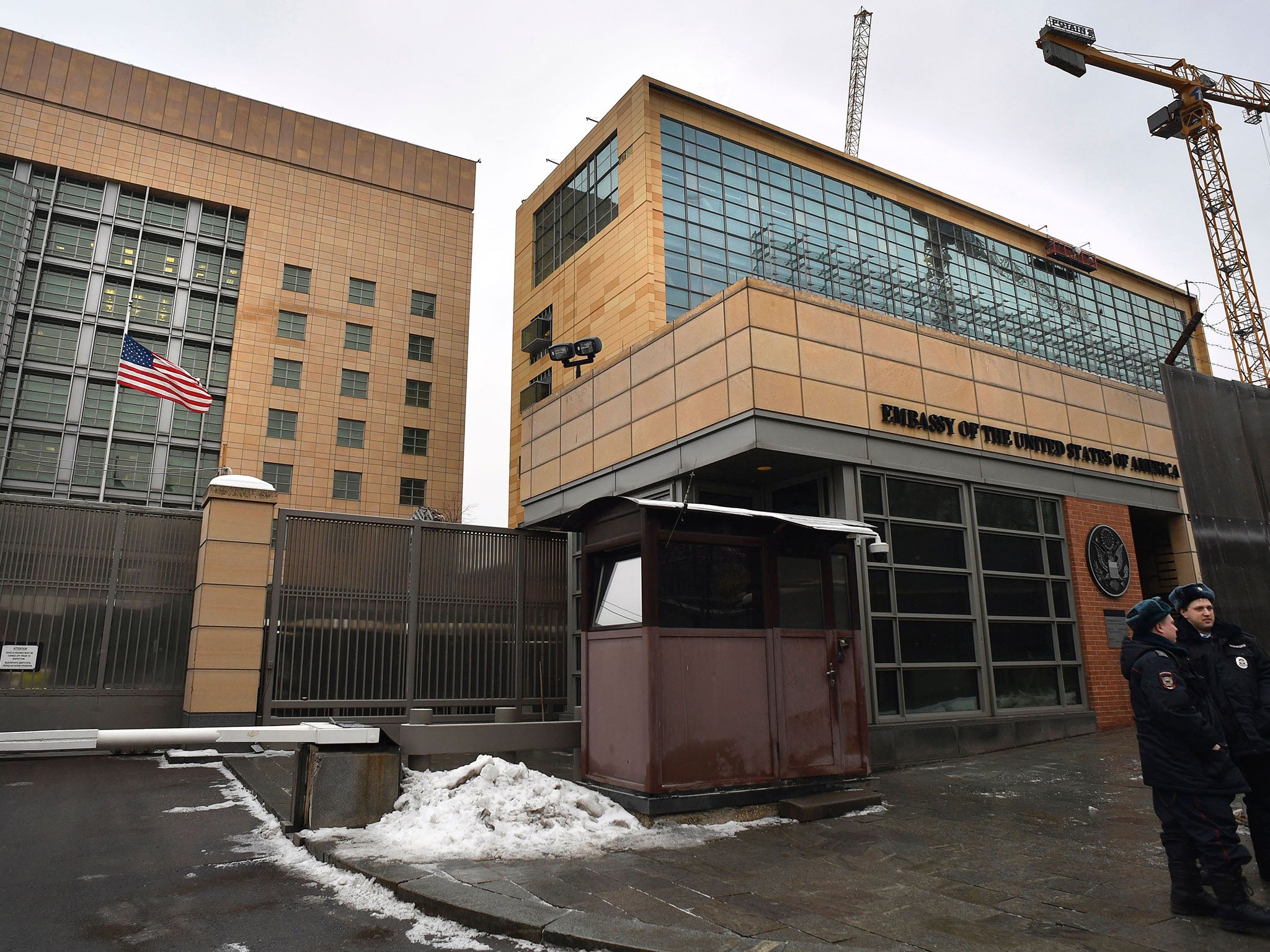 Russian policemen stand guard in front of the US Embassy in Moscow