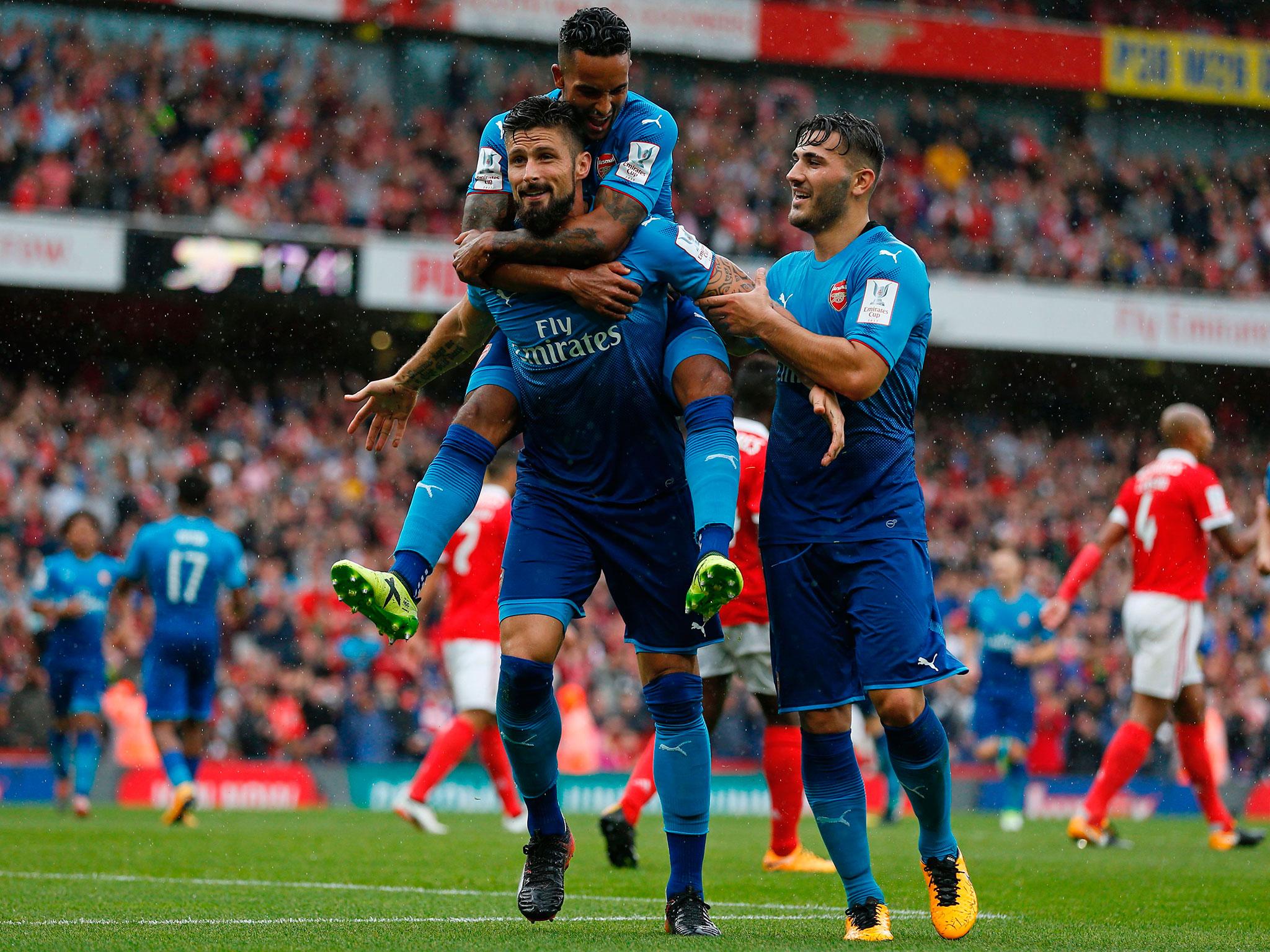 Olivier Giroud celebrates after scoring for Arsenal against Benfica