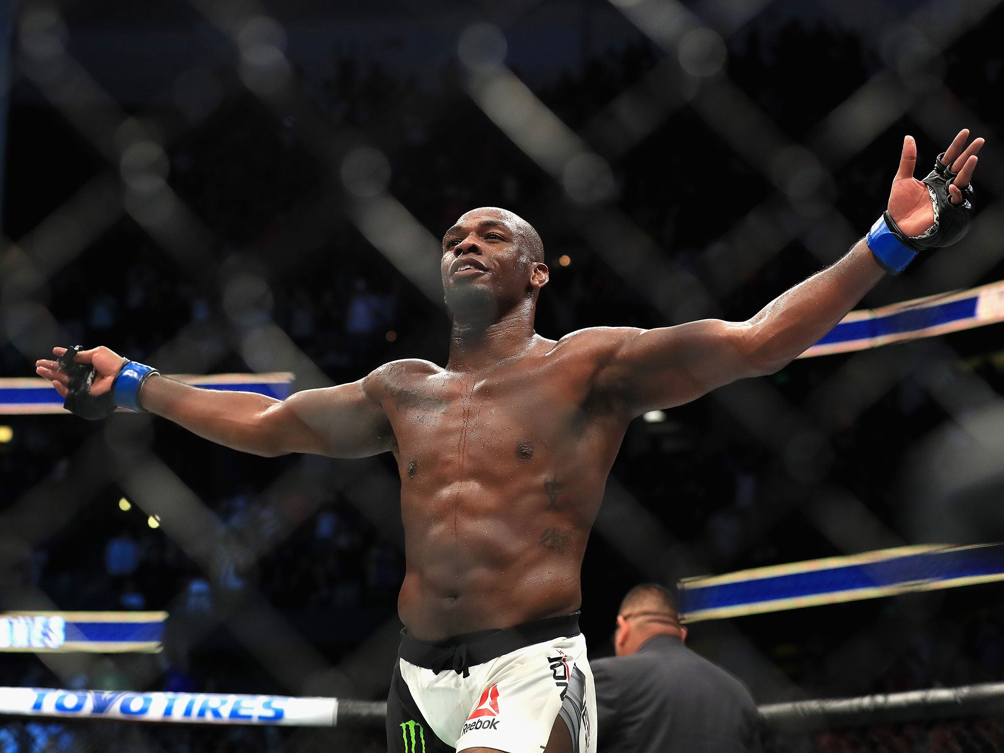 Jon Jones celebrates beating Daniel Cormier at UFC 214 to win the light heavyweight championship