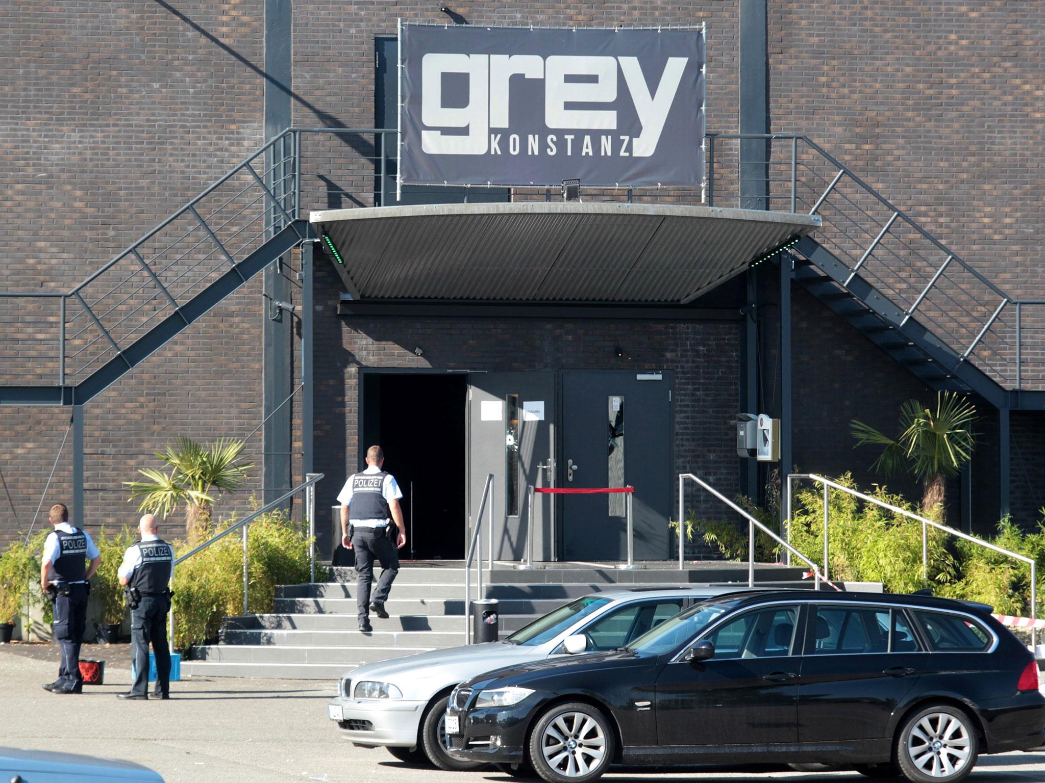 Police officers stand at the door of the Grey nightclub in Konstanz, Germany