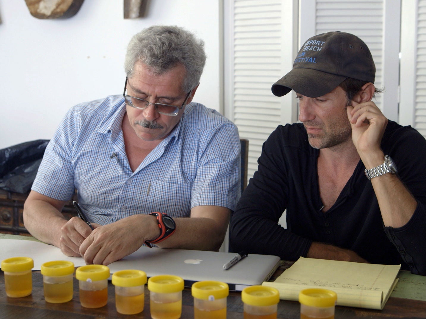 Rodchenkov and Fogel sort through urine samples