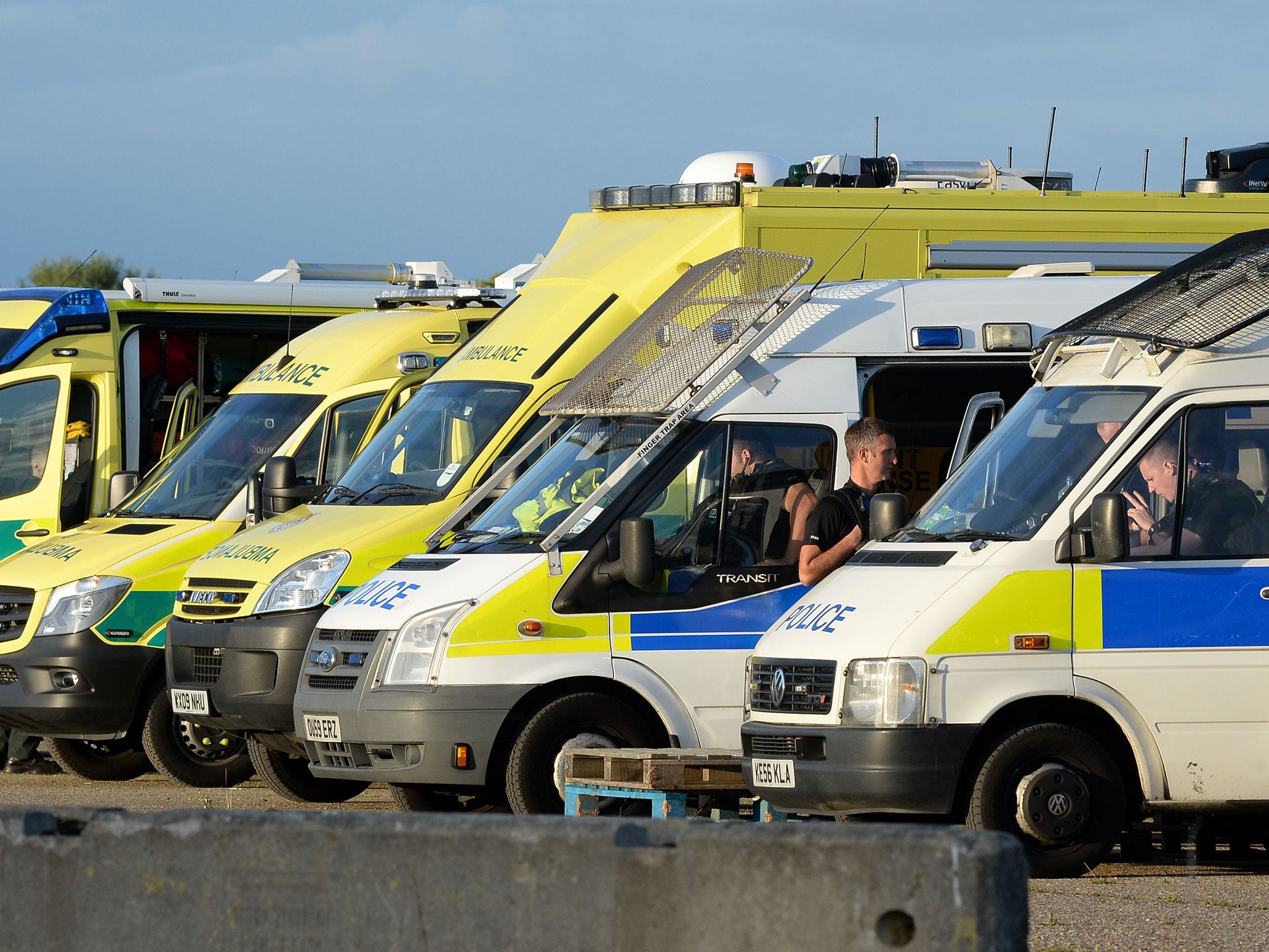 Emergency service vehicles lined up on a former airfield close to The Mount Prison, in Hemel Hempstead, Hertfordshire, on 31 July