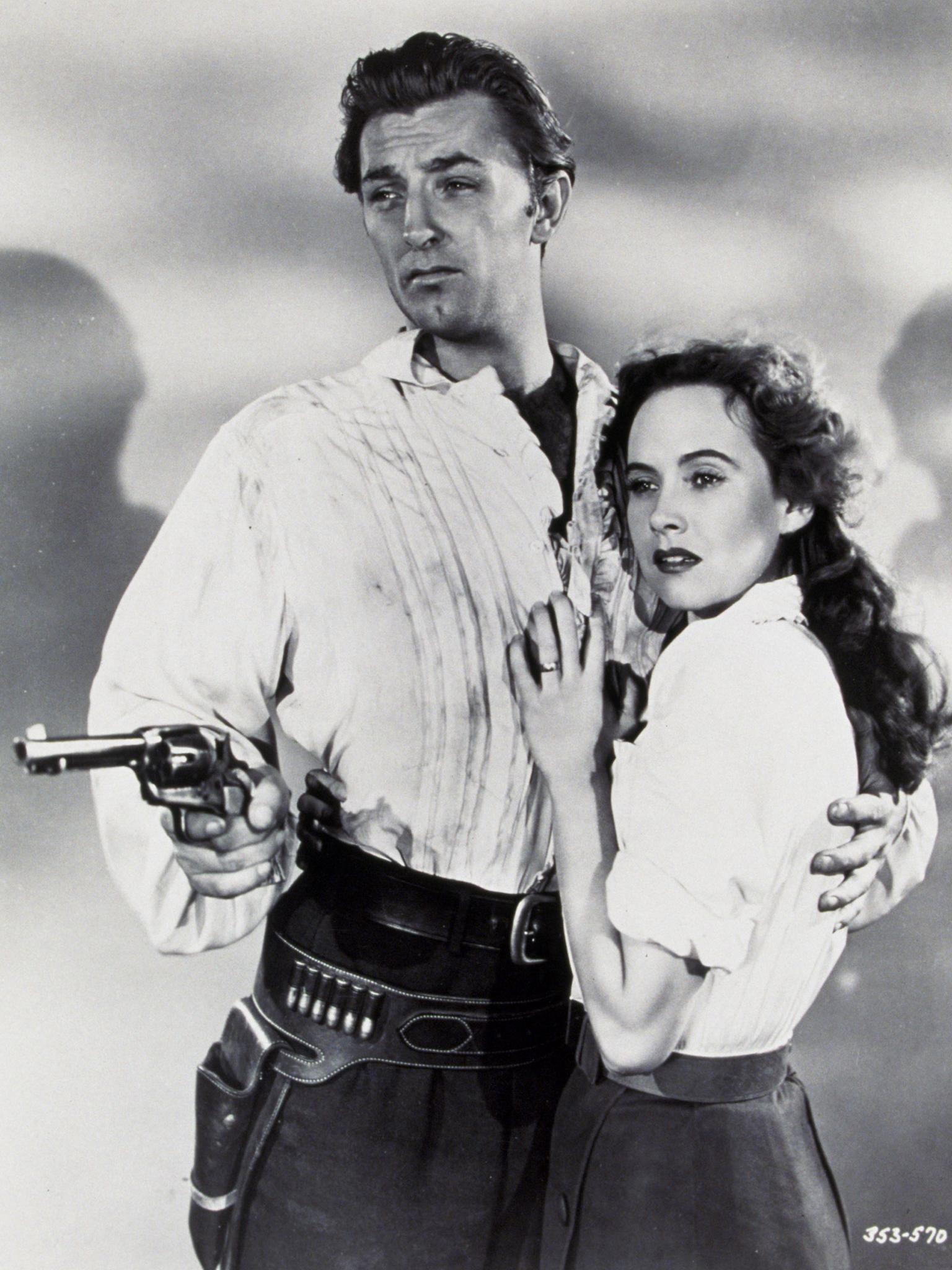 FILM STILLS OF 'PURSUED' WITH 1947, CLOTHING, HAND GUN, ROBERT MITCHUM, RAOUL WALSH, WEAPONS, WESTERN, TERESA WRIGHT IN 1947 1947