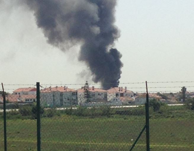 A plume of smoke can be seen billowing from the crash site ( Twitter/@nunoinverno)