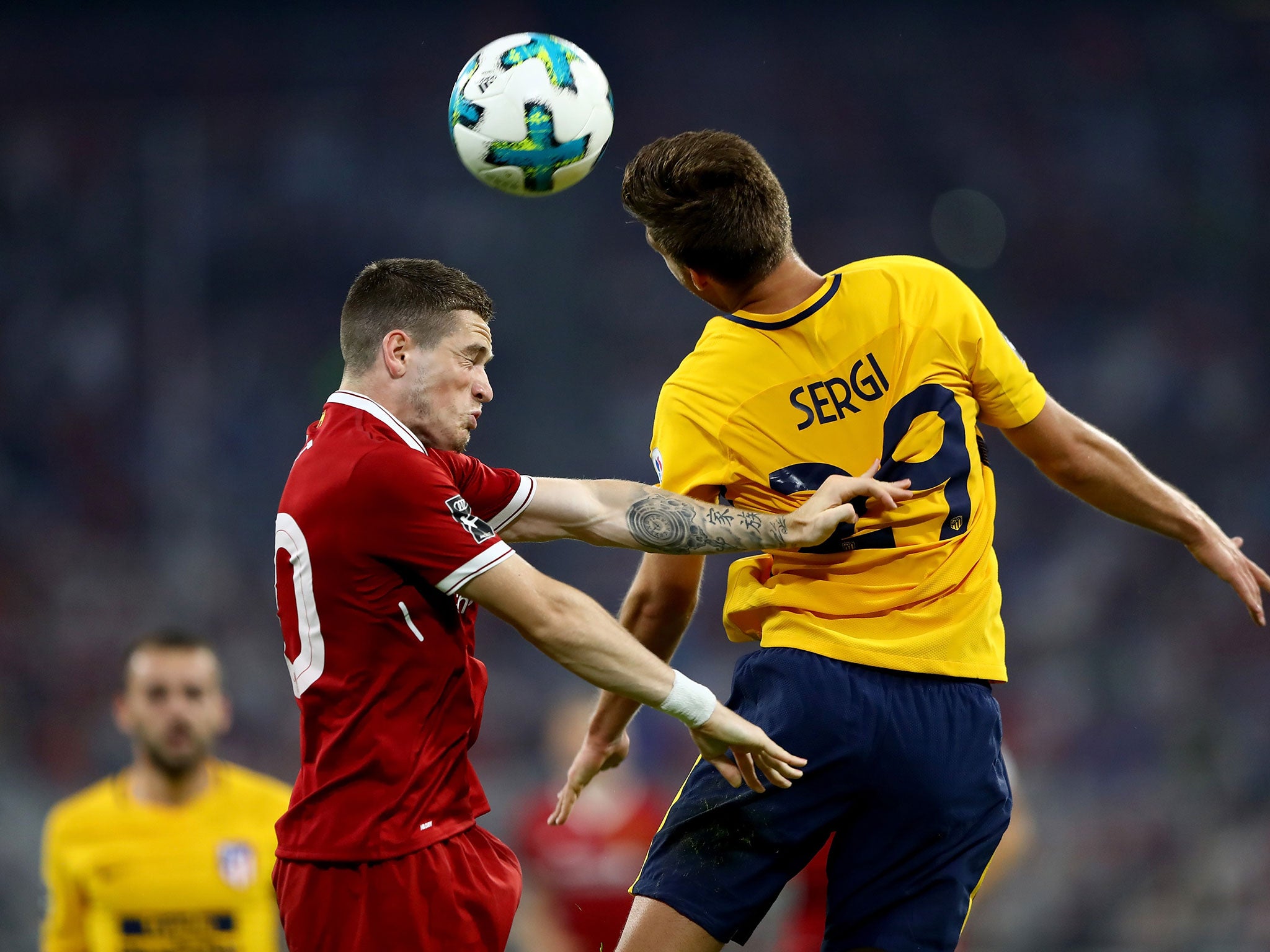 Ryan Kent and Sergi compete for a high ball