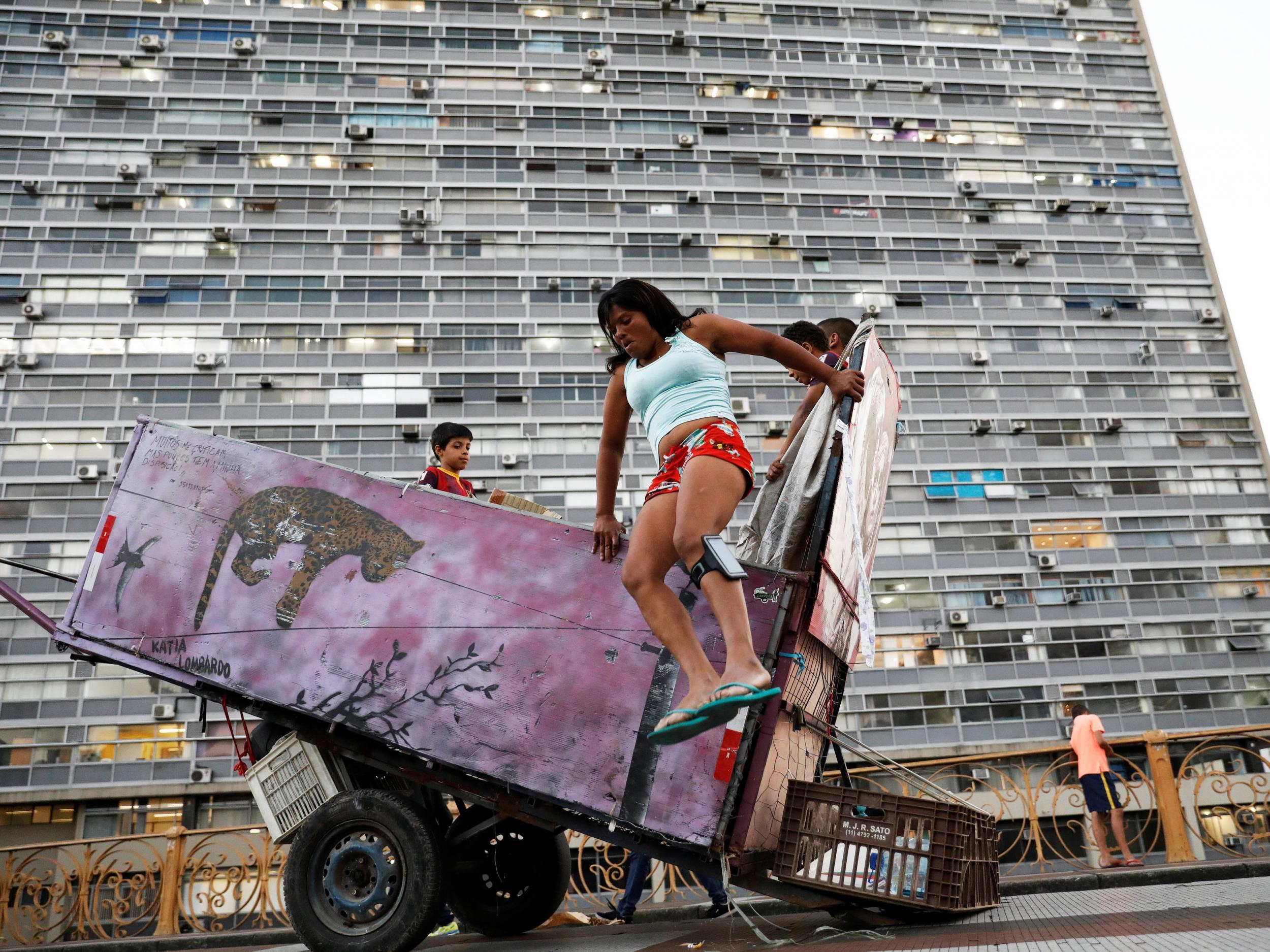 Silva makes a living from collecting recyclable materials. It has allowed her to move into a humble two-storey apartment in Sao Paulo with her boys