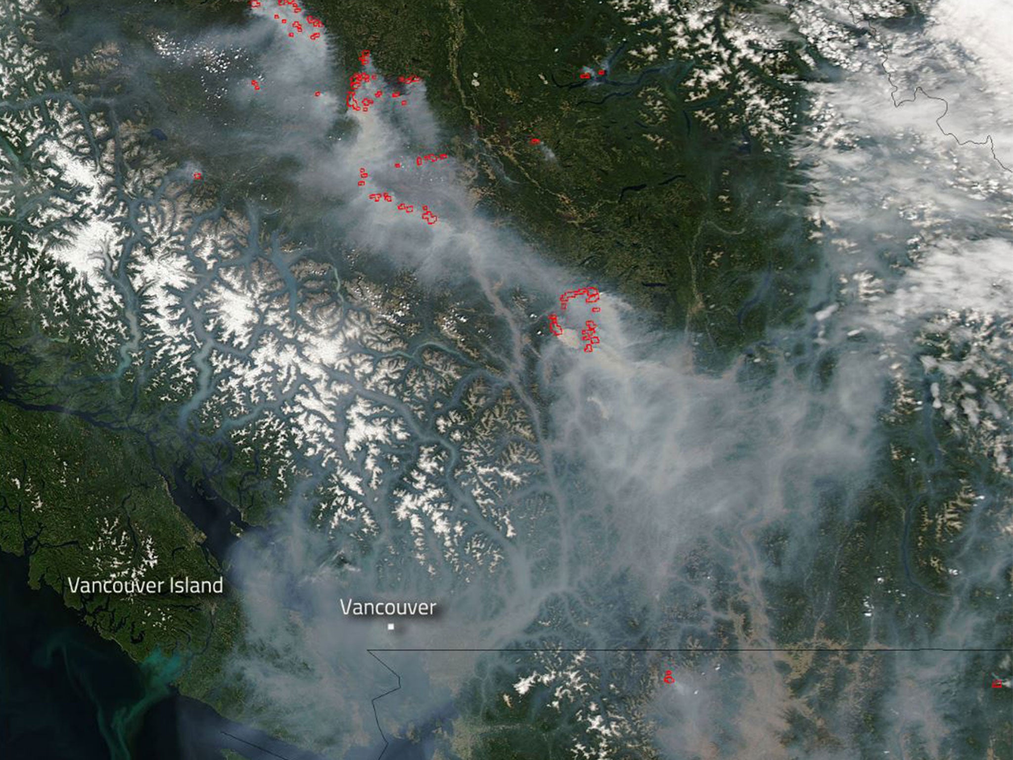 Images taken by NASA's Aqua satellite reveal the extent of smoke pollution in western Canada as a result of the fires