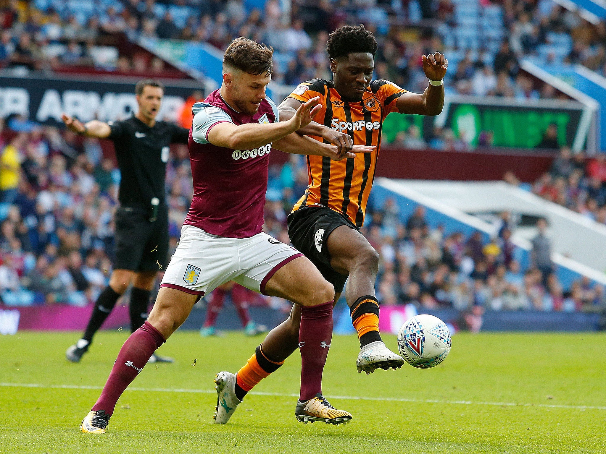 Scott Hogan and Ola Aina tussle for possession