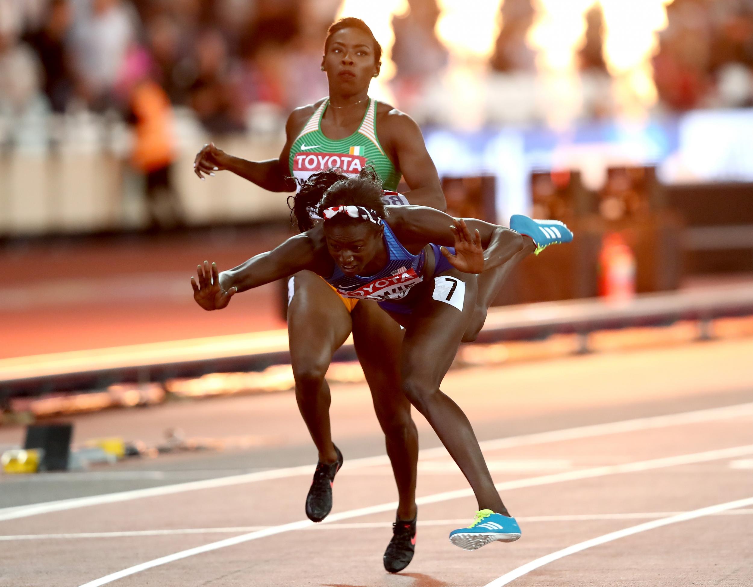 The American threw herself over the line to claim the world title