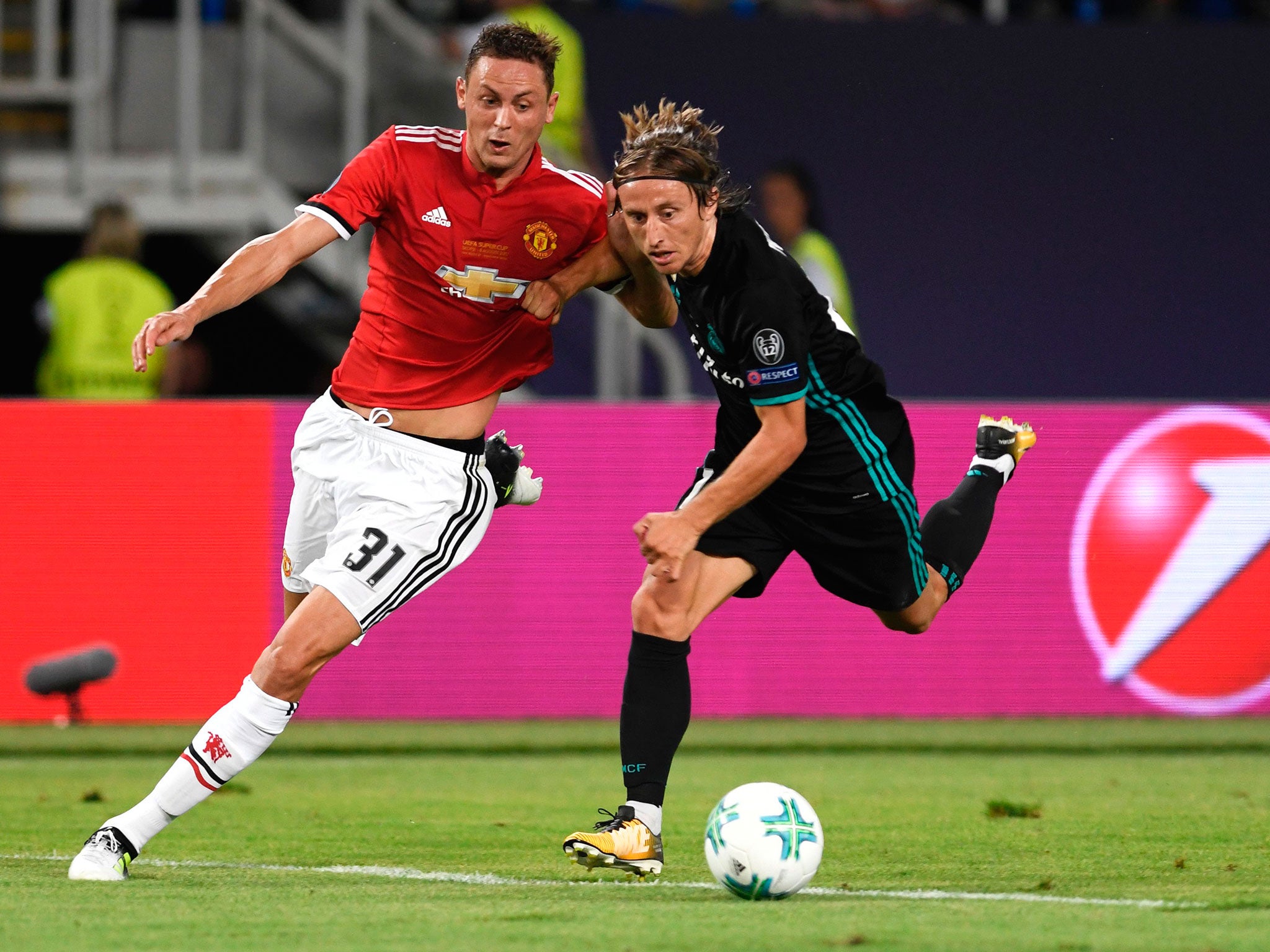 The Serbian tussles for possession with Luka Modric during Tuesday's match