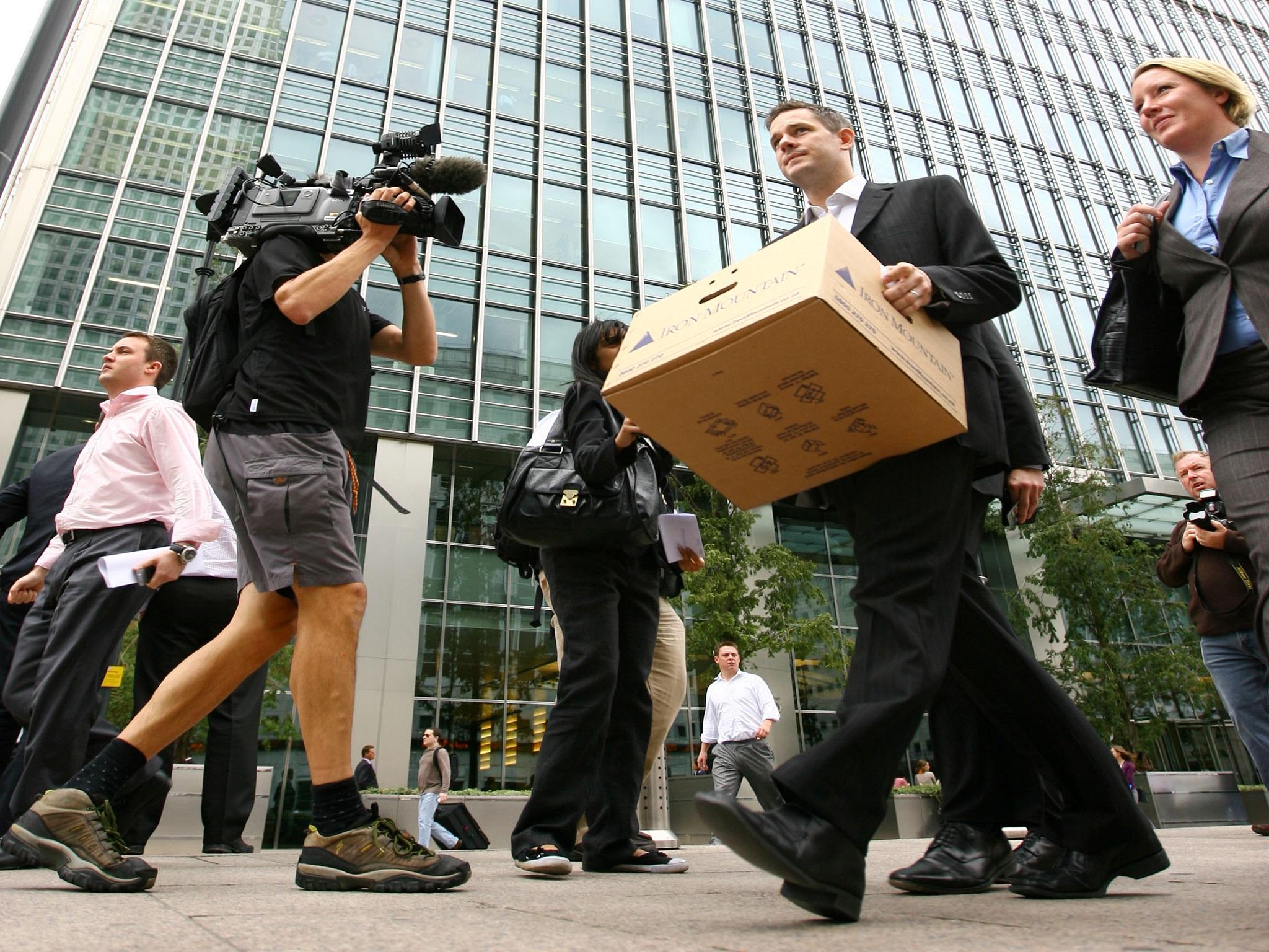 Bankers leave Lehman Brothers in Canary Wharf, London, after it went bust