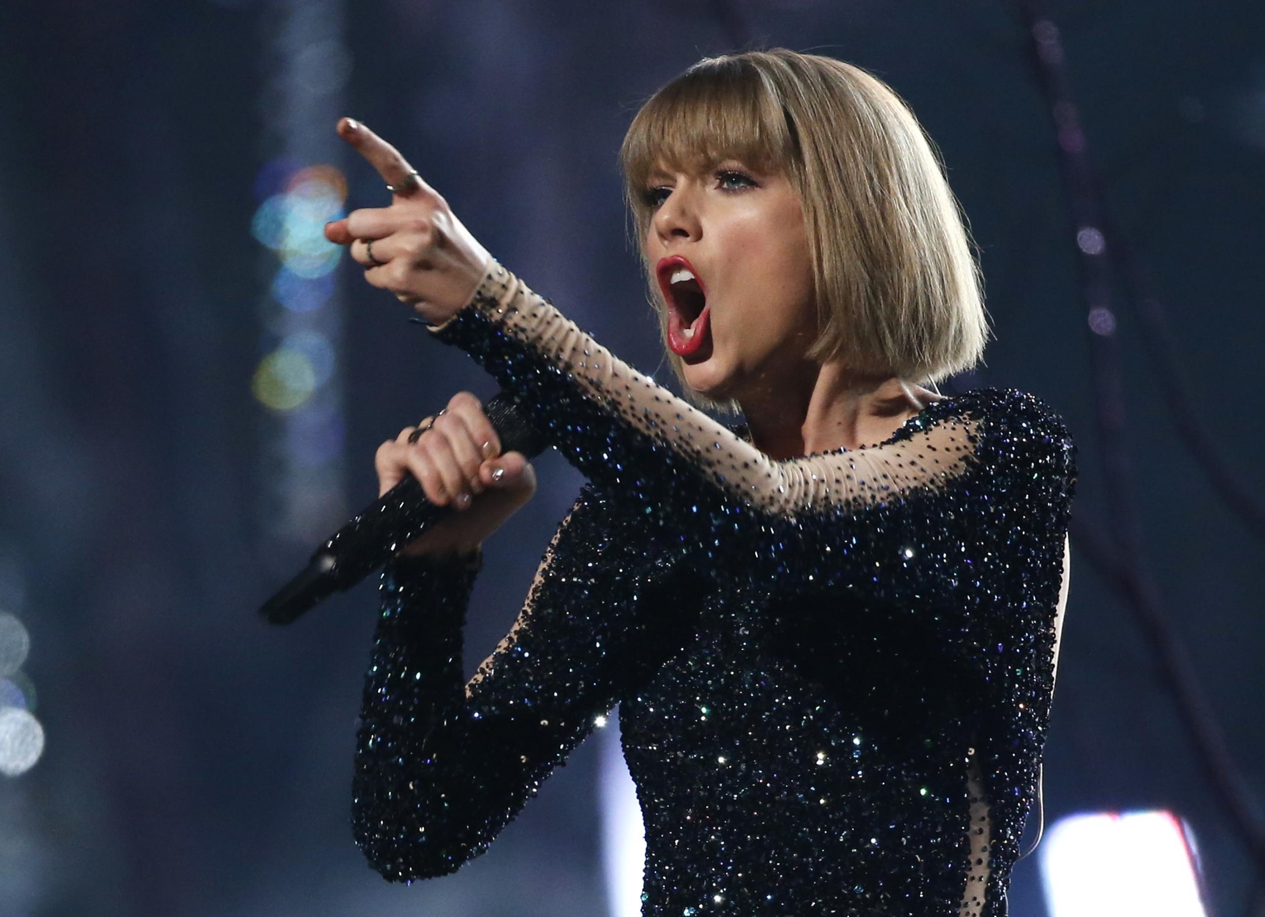 Taylor Swift performs "Out of the Woods" at the 58th Grammy Awards in Los Angeles, California