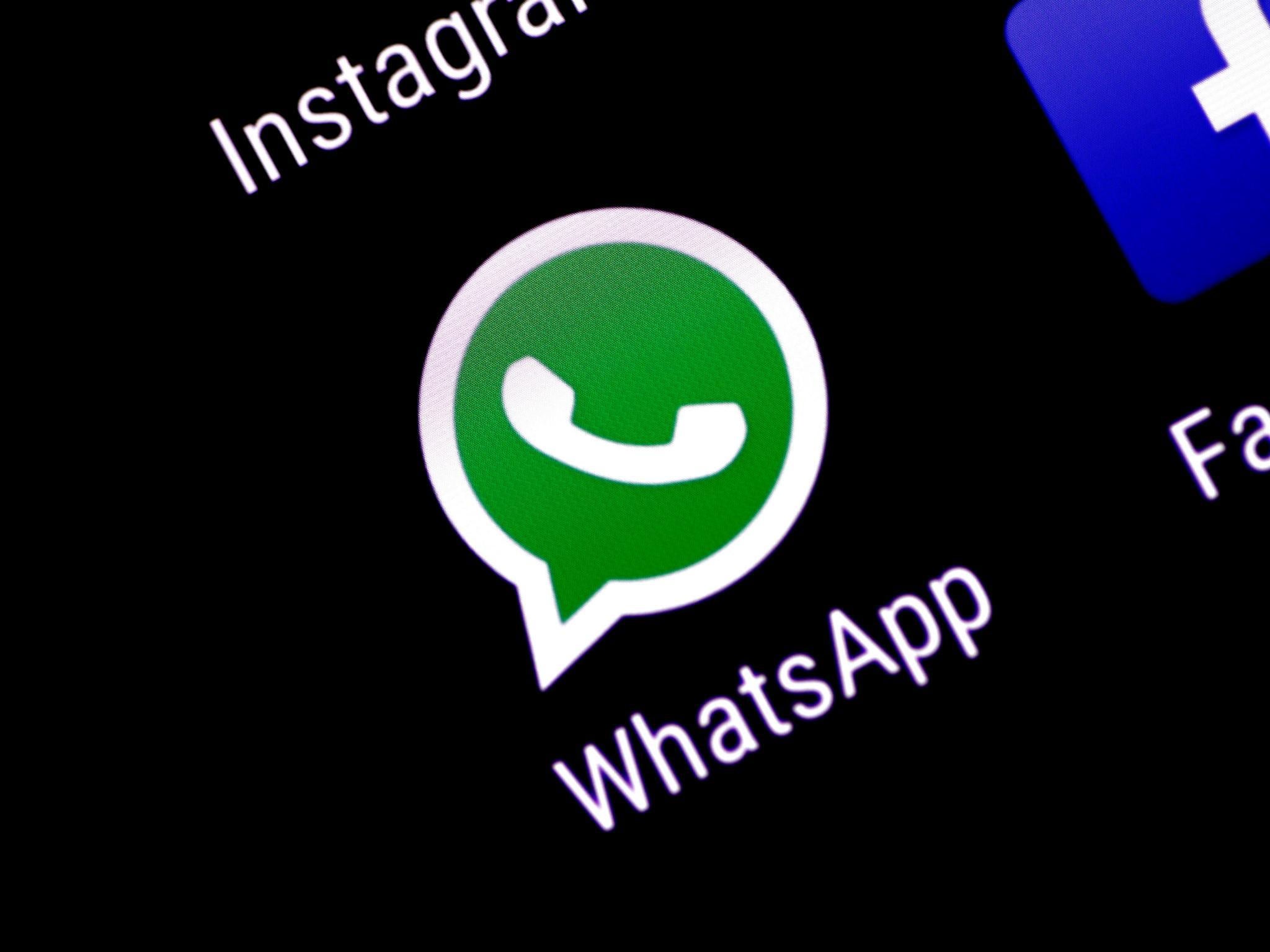 The WhatsApp messaging application is seen on a phone screen