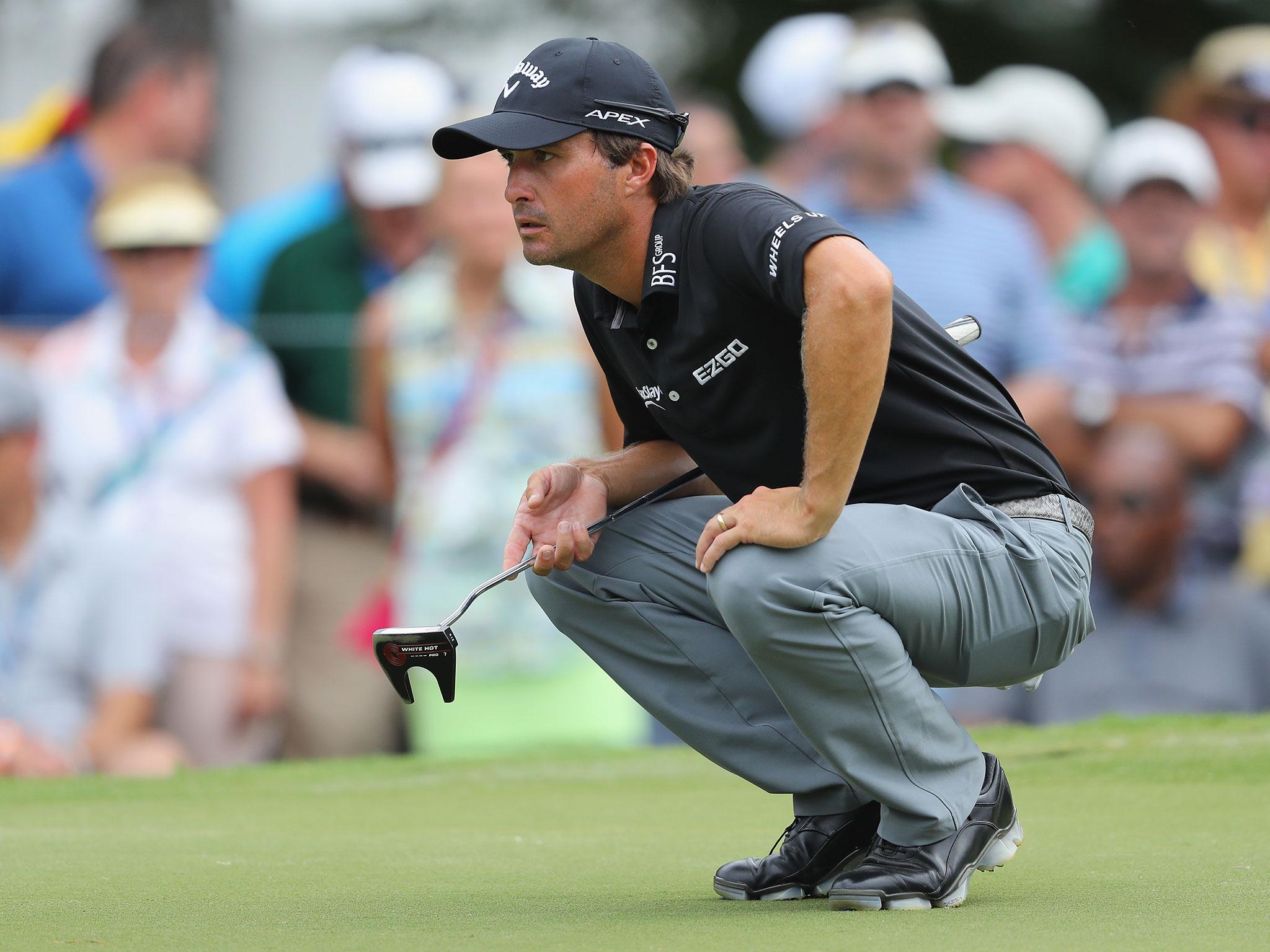 &#13;
Kisner of the United States lines up a putt on the ninth green &#13;