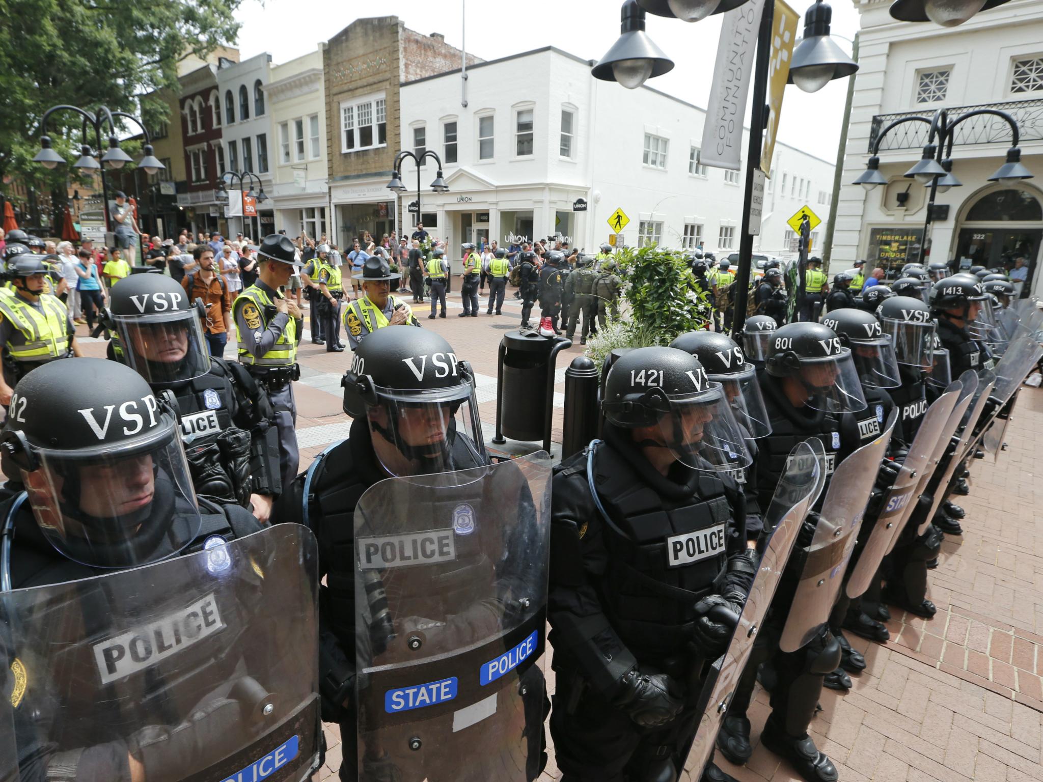 Virginia State Police cordon off an area around the site where a car ran into a group of protesters after a white nationalist rally in Charlottesville, Virginia