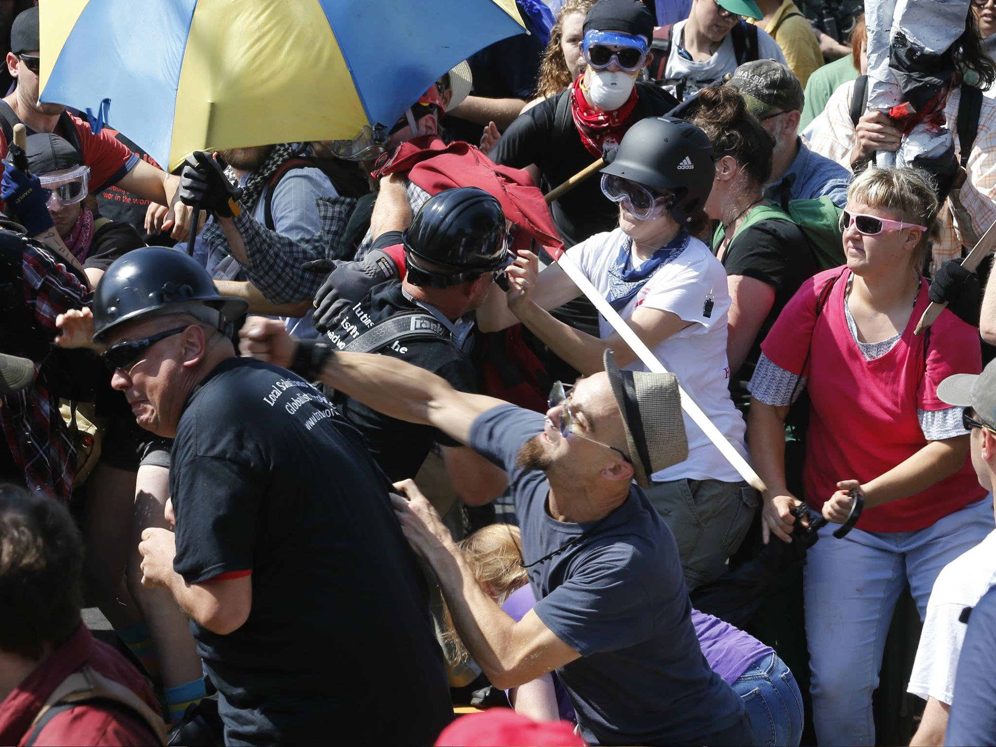 White nationalist demonstrators clash with counter demonstrators at the entrance to Lee Park in Charlottesville, Virginia. A state of emergency is declared, August 12 2017
