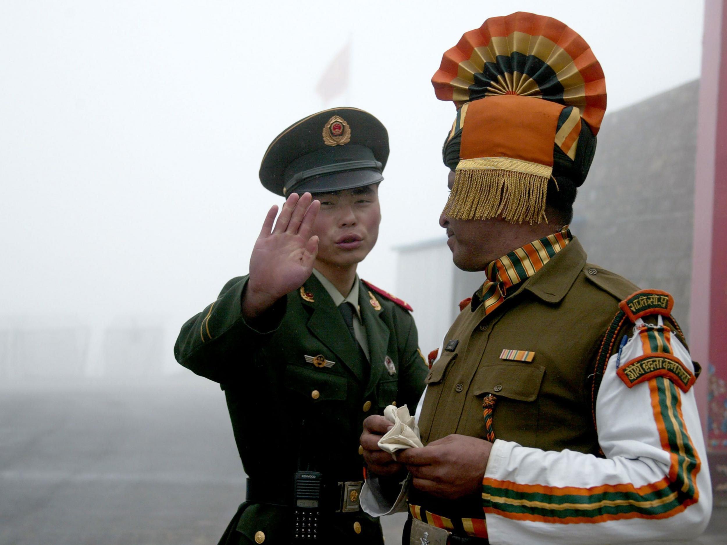 China has stepped up its rhetoric in an increasingly tense border row with India, hinting at the possibility of military action