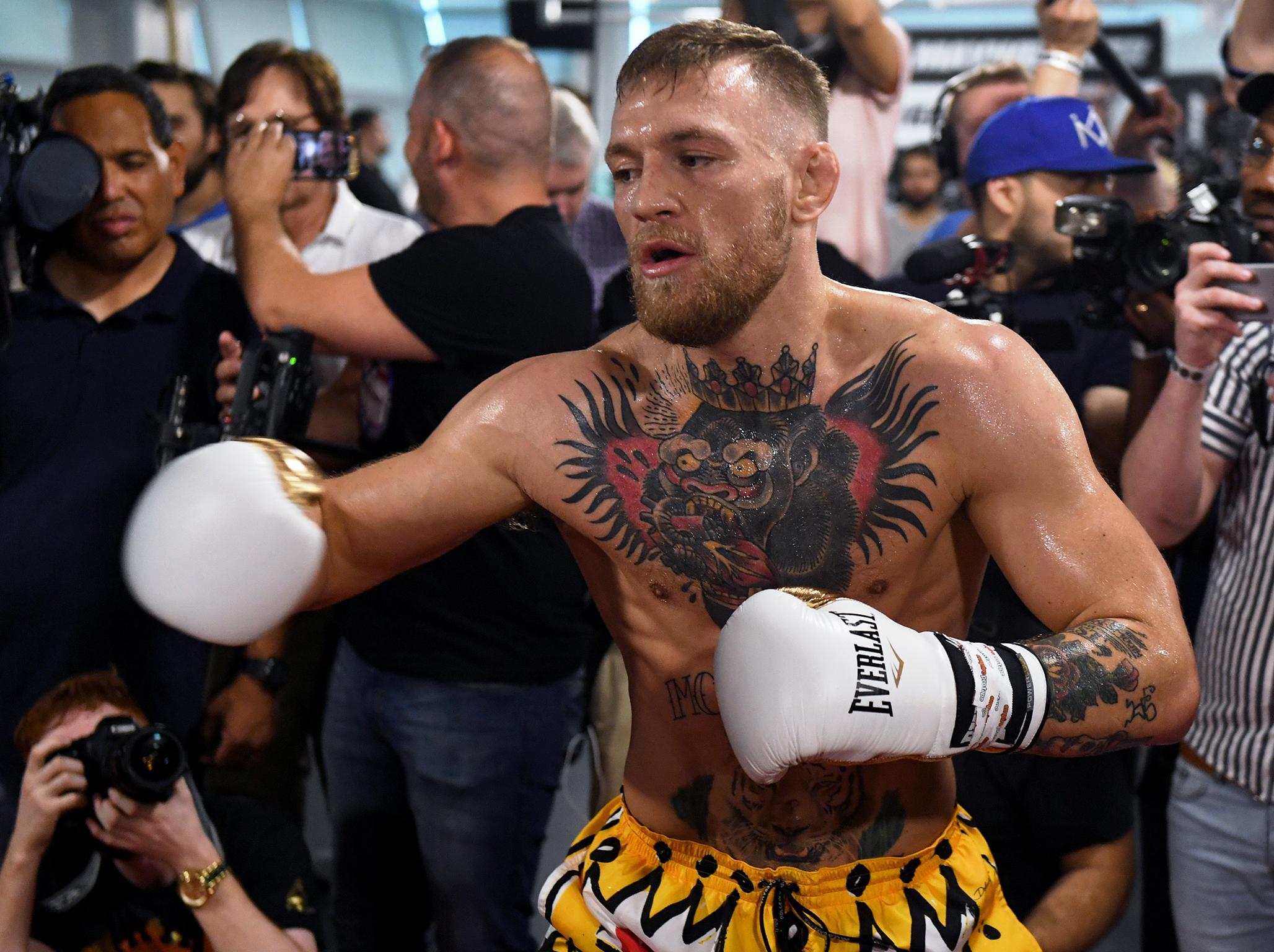 McGregor accepted Mayweather's challenge to wear 8oz gloves (Getty)