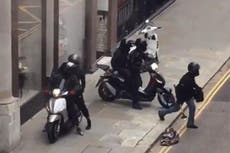 Robbers on mopeds ransack London jewellery store in broad daylight as people film on phones