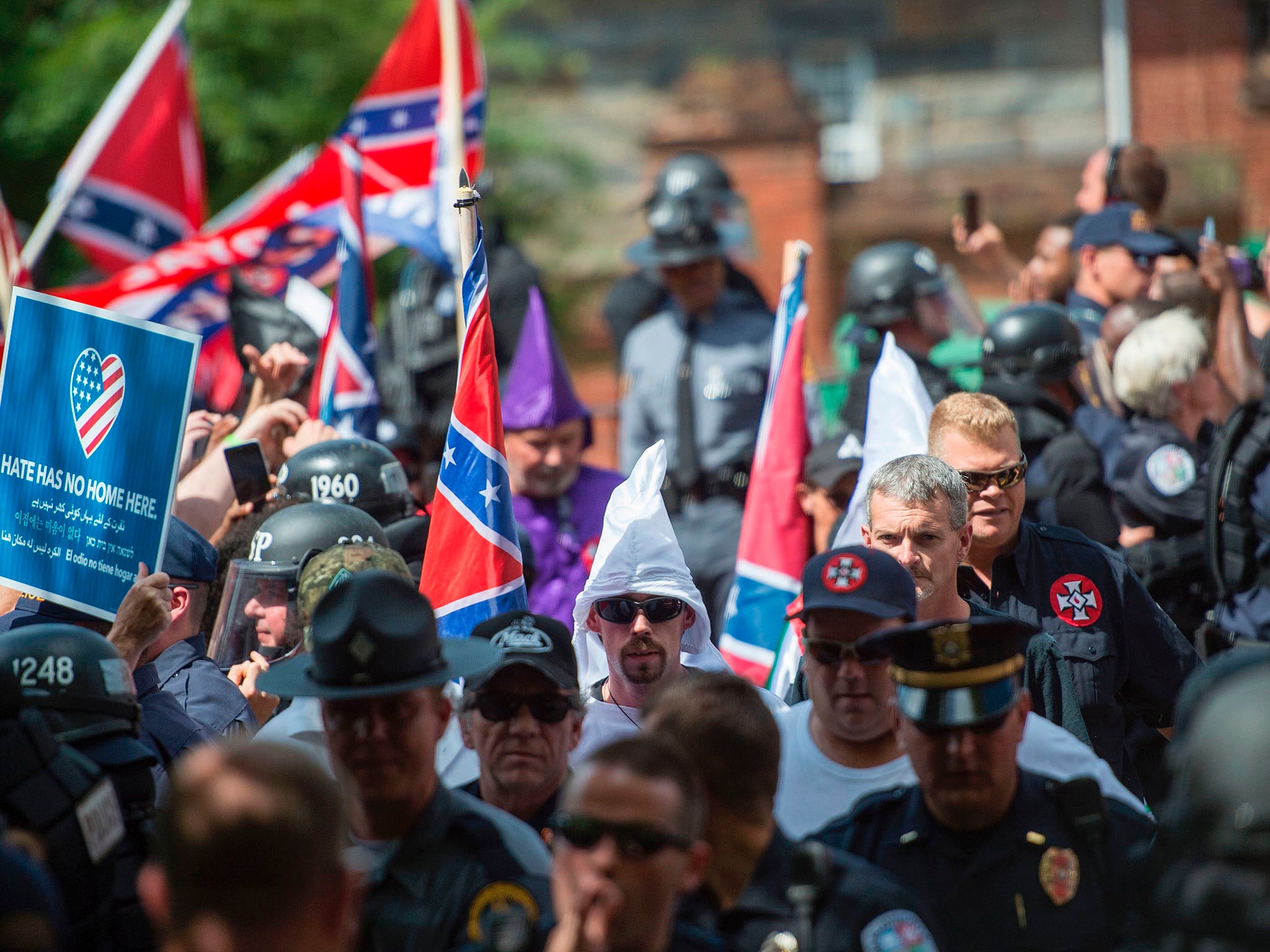 Protesters, including members of the Ku Klux Klan, protest against the removal of a Confederate statue on July 8, 2017