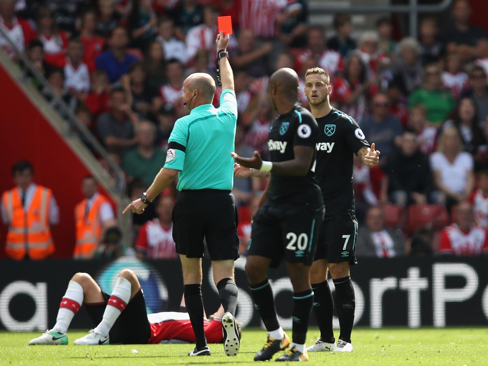 Marko Arnautovic is shown a straight red card for an elbow on Jack Stephens