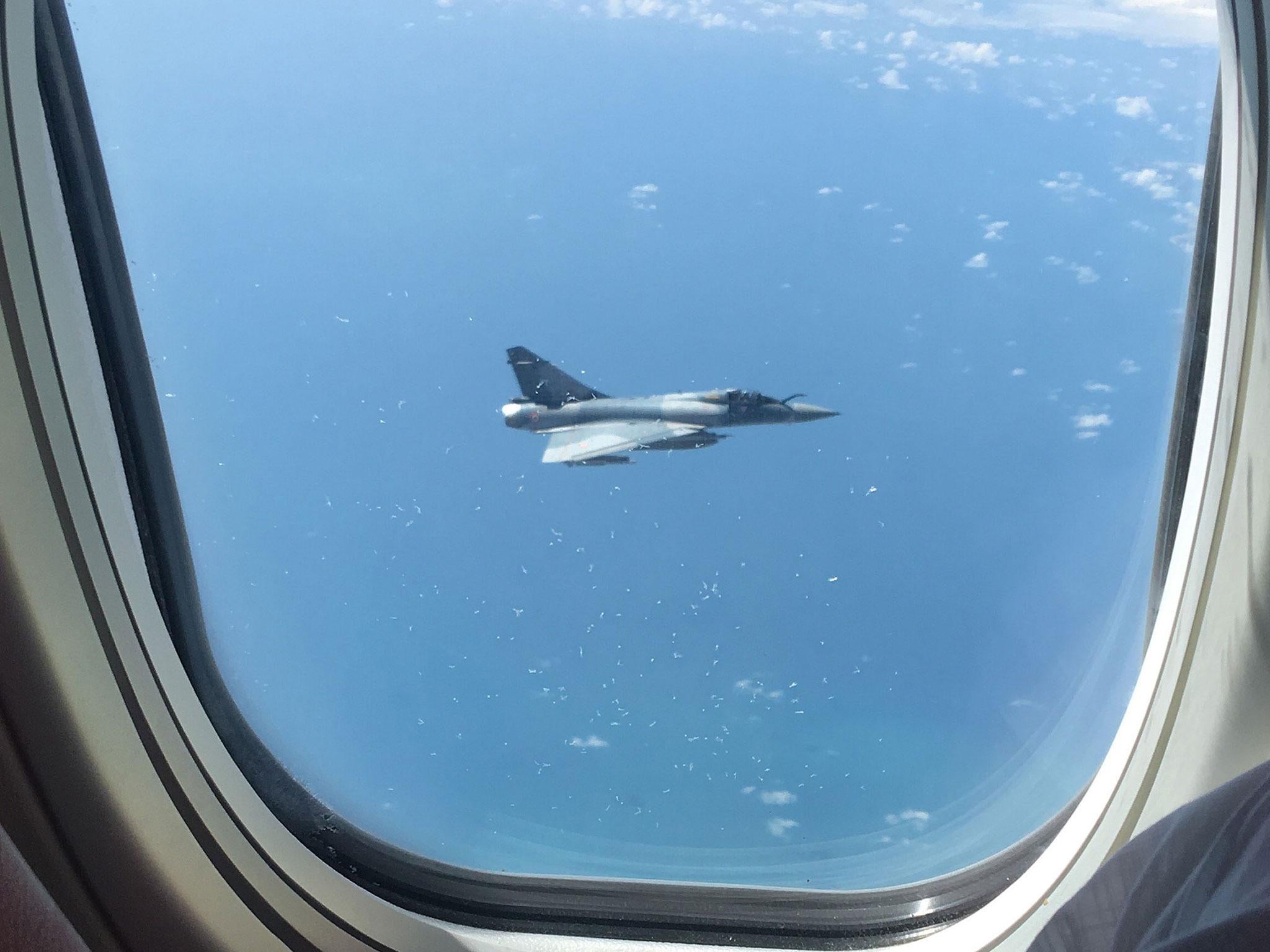 A photo taken by a passenger shows the French jet shadowing the Jet2 plane