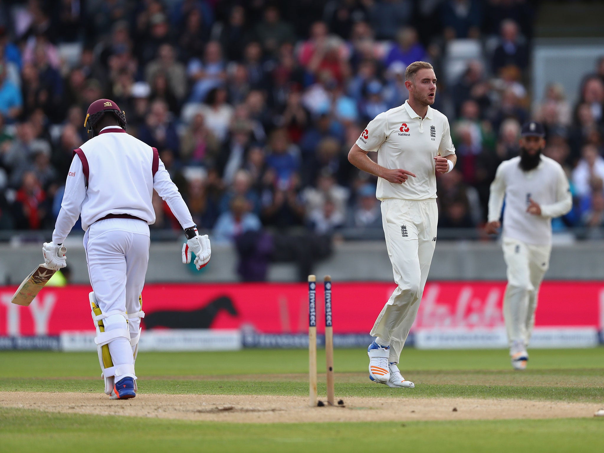 Kemar Roach is bowled by Stuart Broad