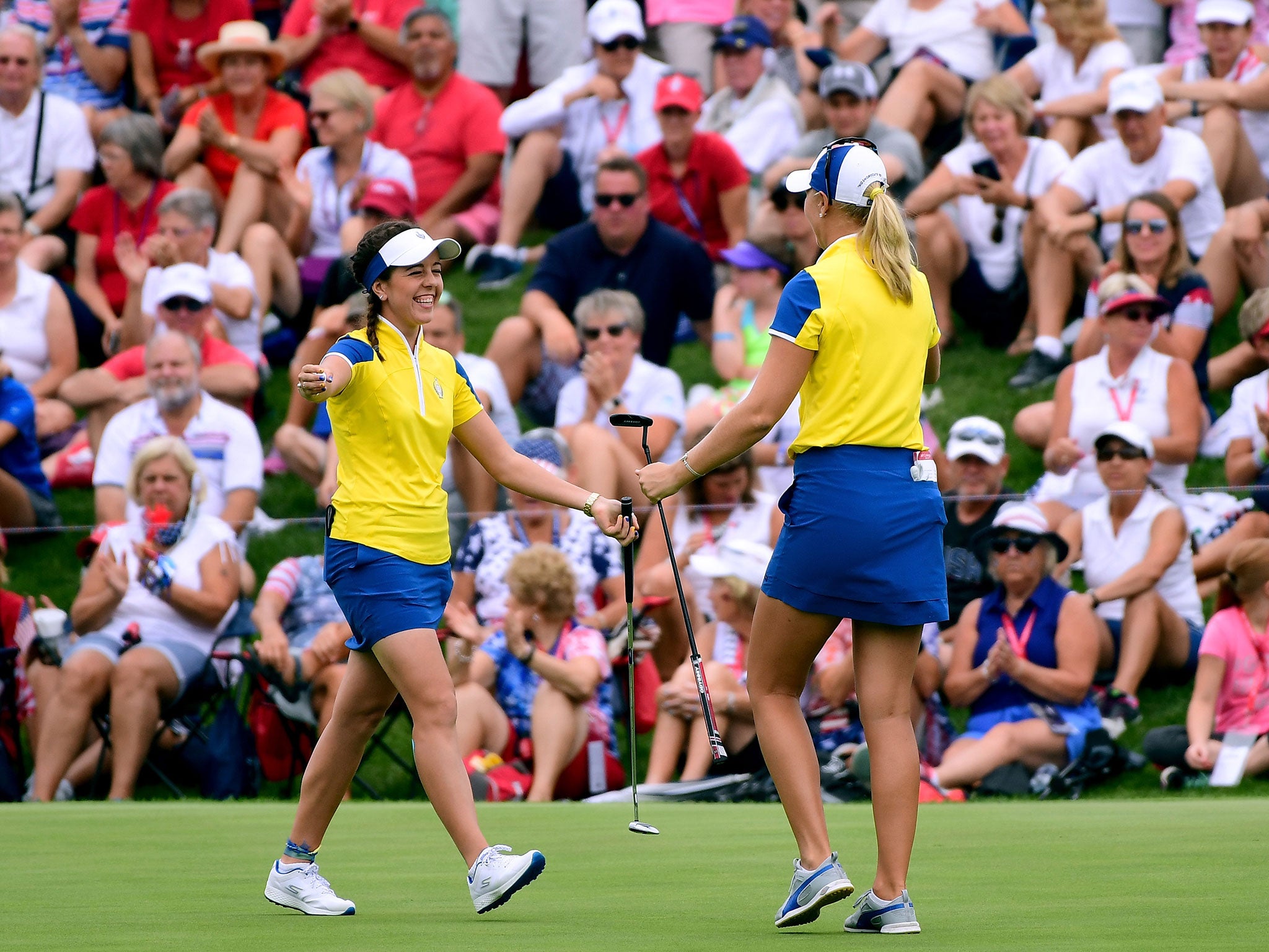 Georgia Hall of Team Europe celebrates her putt with Anna Nordqvist, for a two and one victory over Team USA