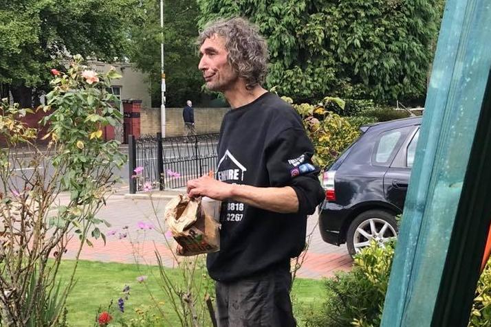 The roofers gave John a company jumper and bought him lunch