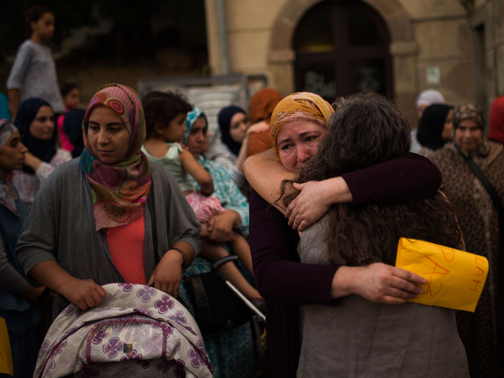 Members of the local Muslim community gather along with relatives of young men believed responsible for the attacks in Barcelona and Cambrils to denounce terrorism and show their grief in Ripoll, north of Barcelona, Spain