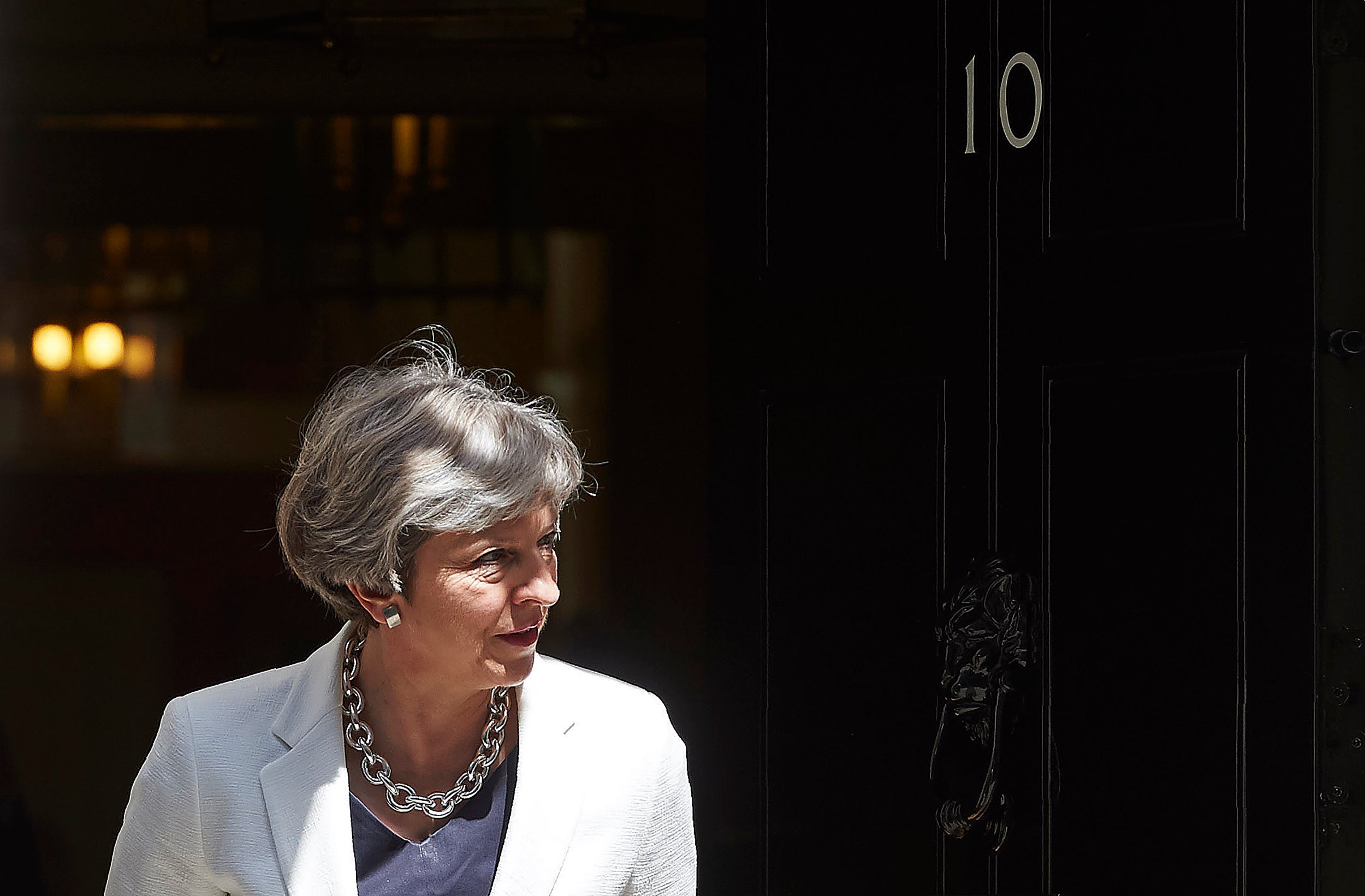 Theresa May exits 10 Downing Street in central London on July 18, 2017