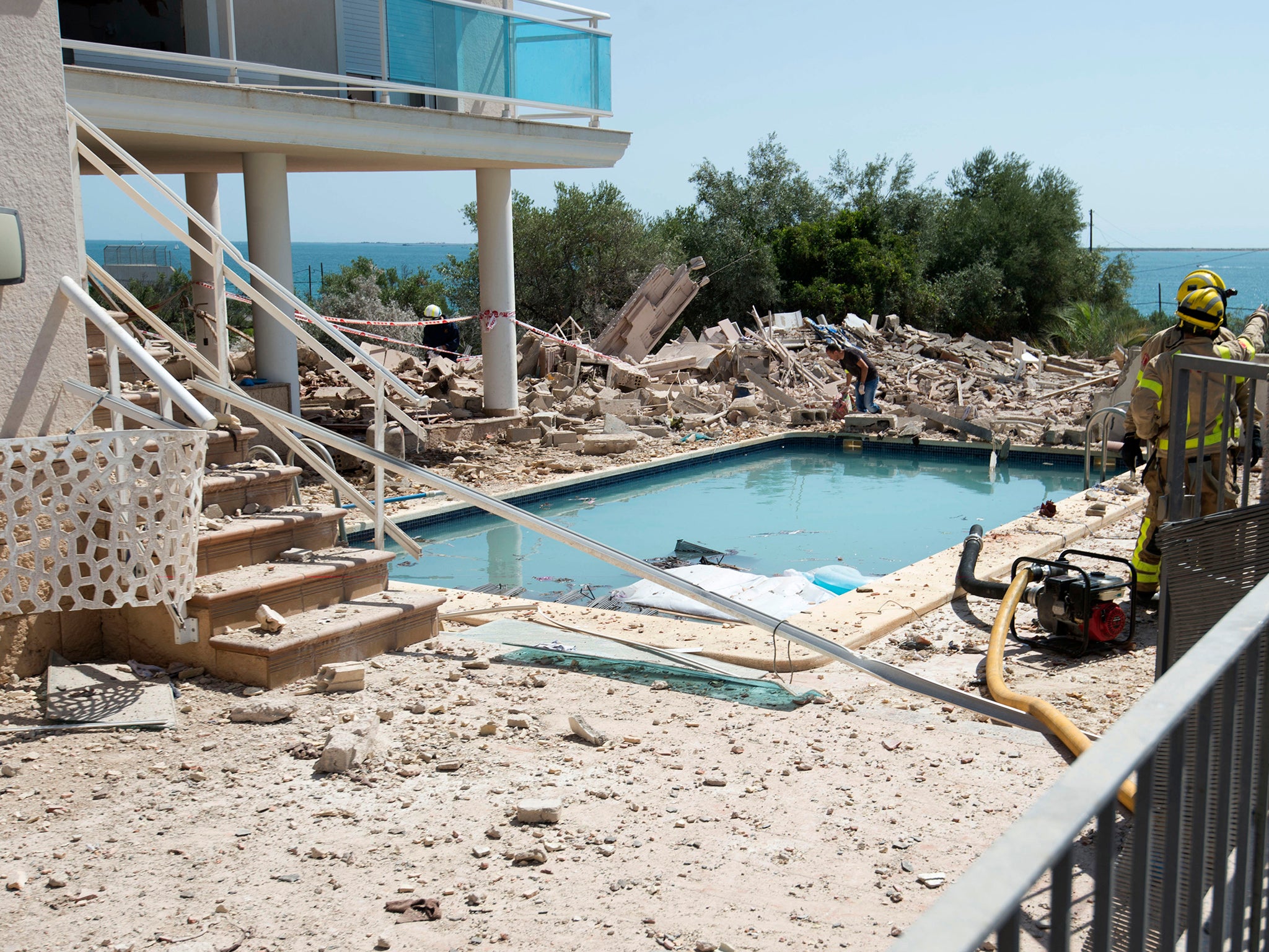 More than 120 butane gas tanks and three bodies were found in the rubble of a suspected bomb factory in Alcanar last week